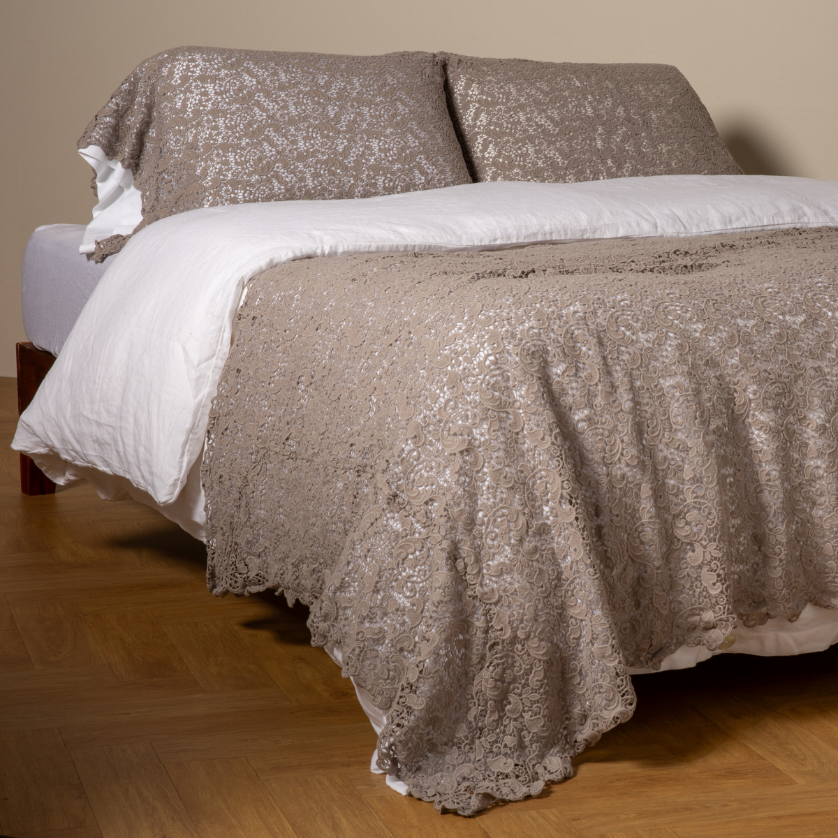 Fog: cotton lace bed scarf draped across the foot of a bed dressed in linen sheets and duvet cover in winter white - shown with matching lace pillowcase covers over a linen liner in winter white.