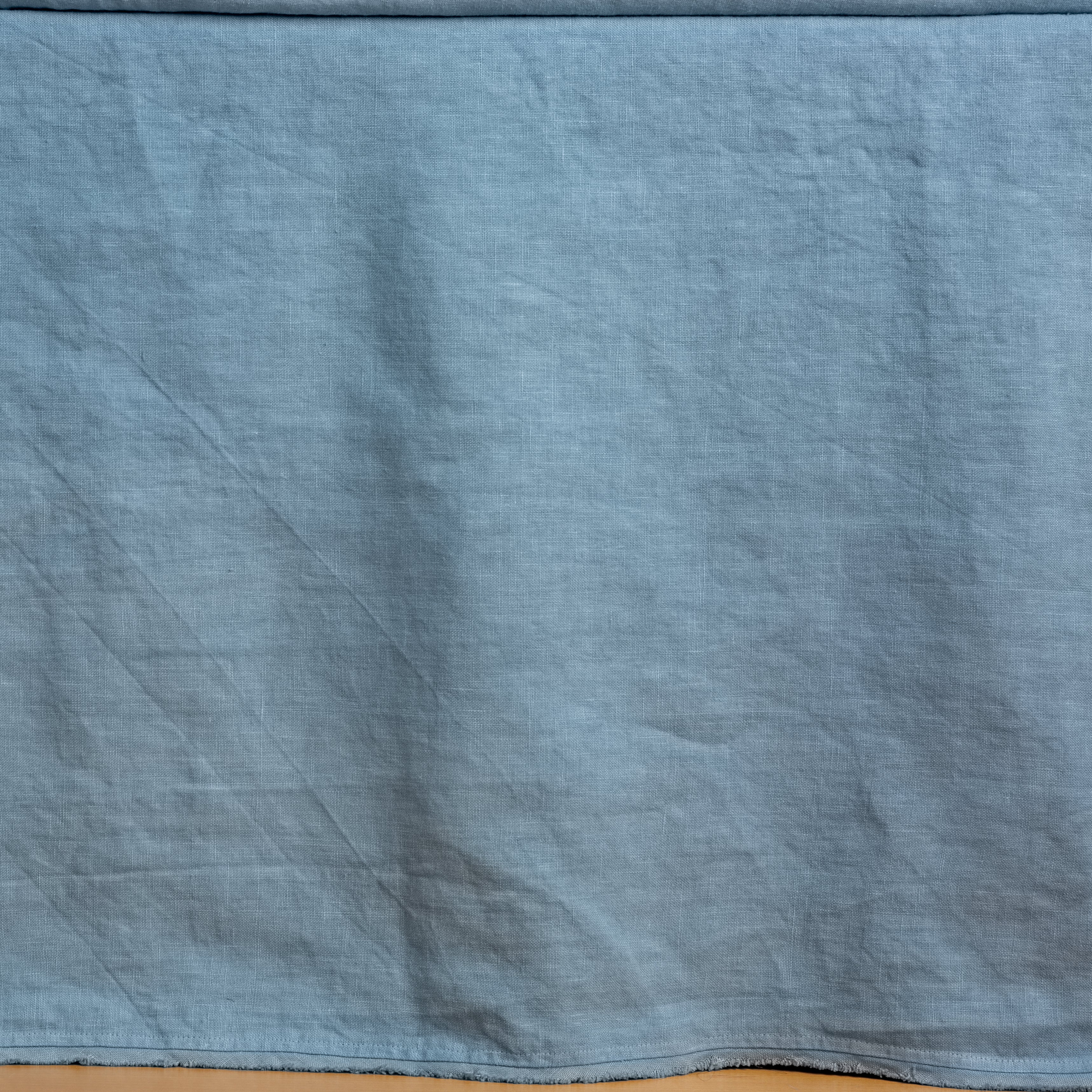 Tahoe Blue: Close up of the Austin bed skirt in tahoe blue, highlighting its tailored, ungathered style.