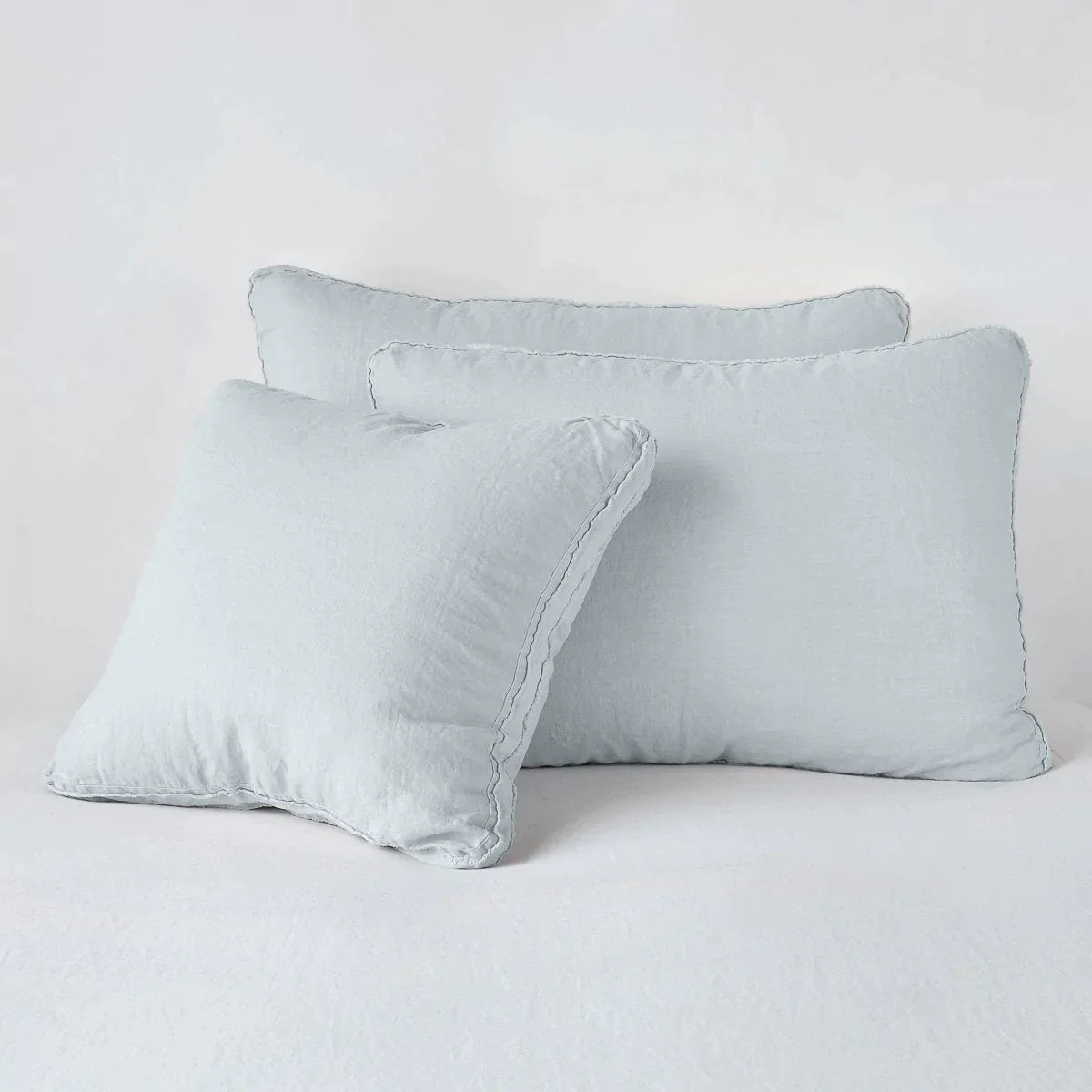 Cloud: Midweight linen shams in cloud colorway shown leaning upright on white background.