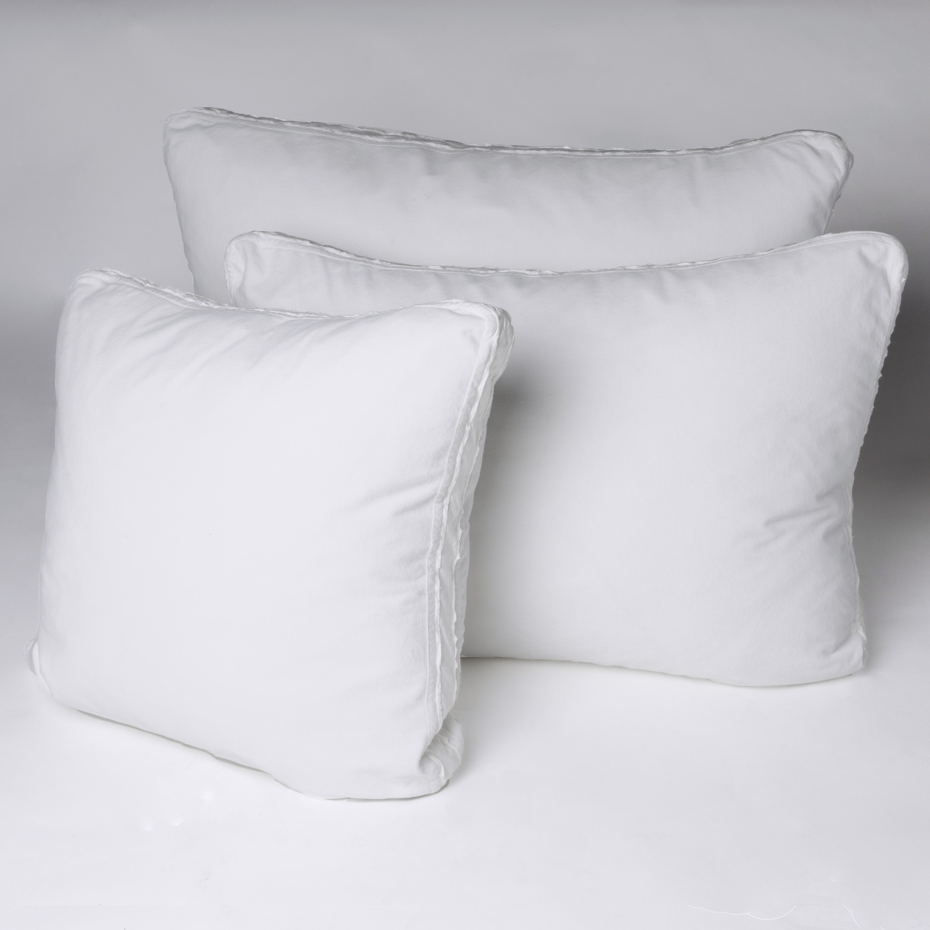 : Harlow shams leaning upright against a plain background - white.