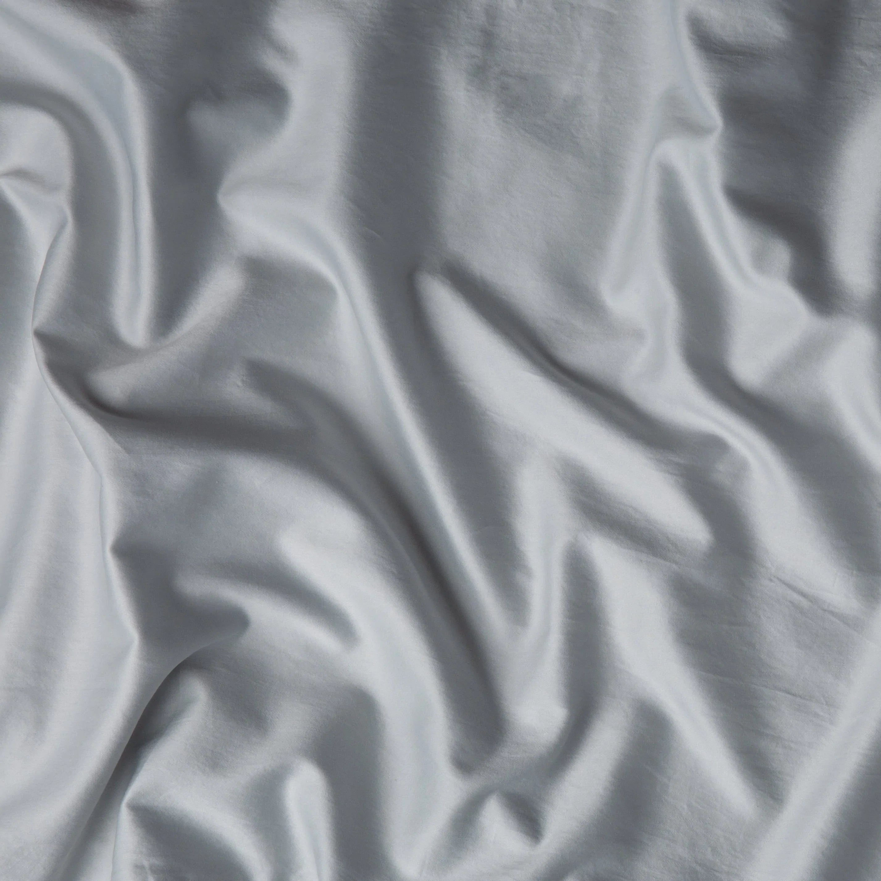 Cloud: A close up of cotton sateen fabric in sterling, a silvery neutral light grey.