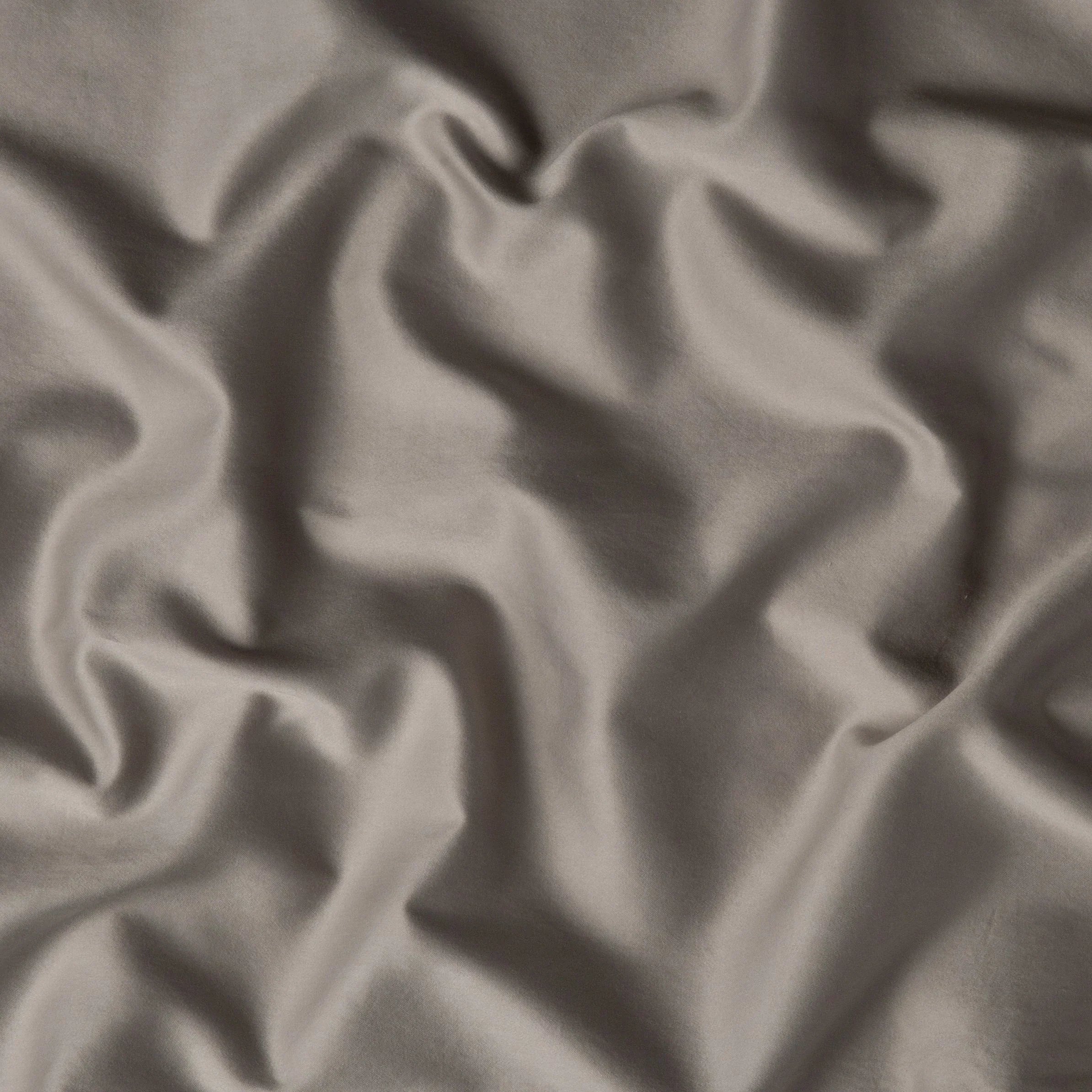 Fog: A close up of cotton sateen fabric in fog, a neutral-warm, soft mid-tone grey.