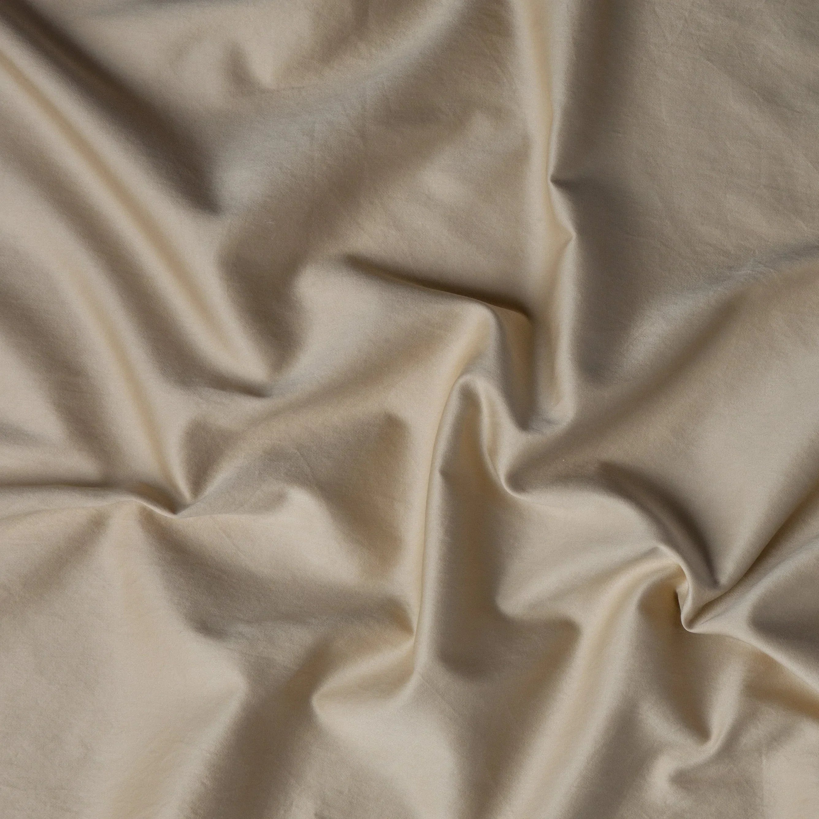 Honeycomb: A close up of cotton sateen fabric in honeycomb, a warm golden tone.