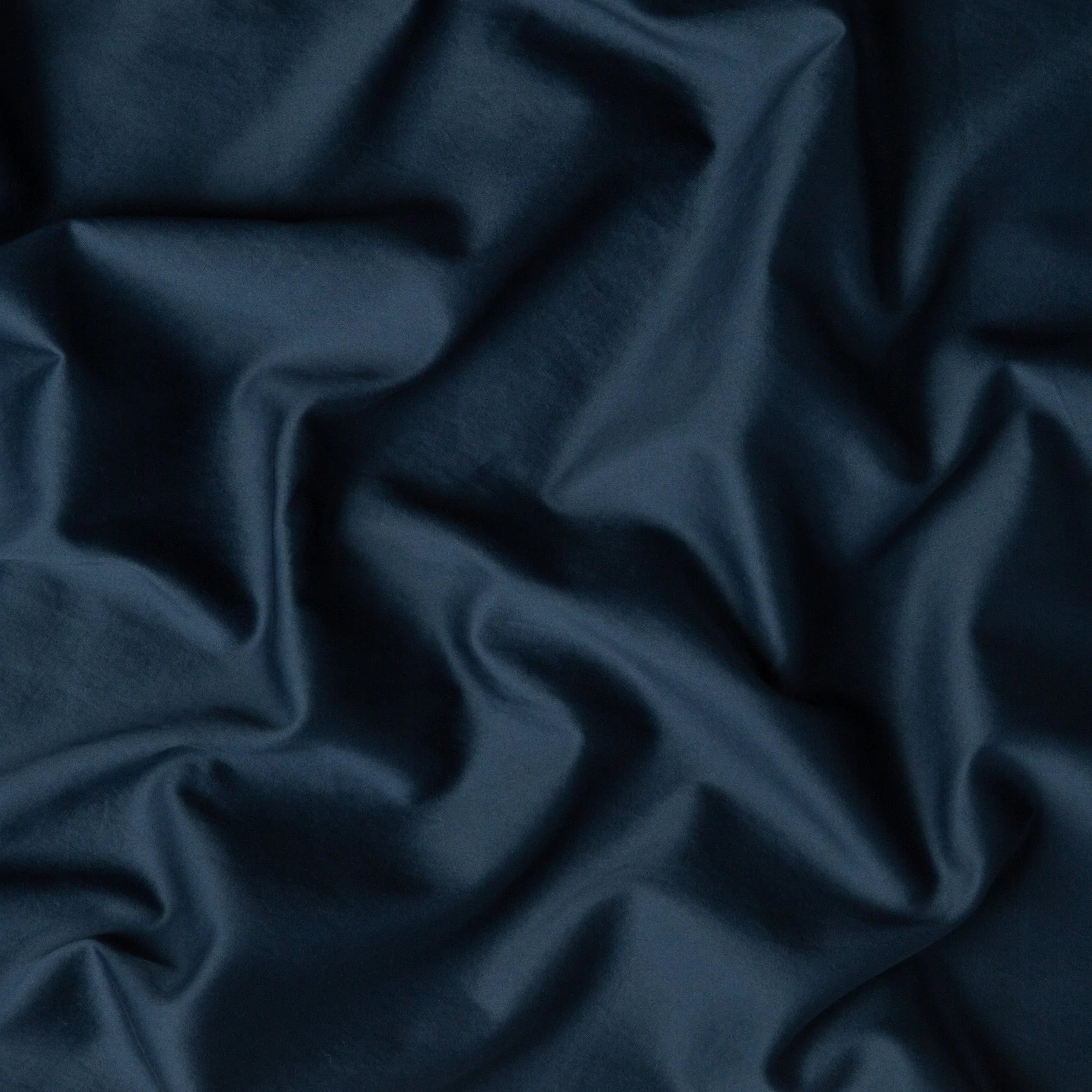 Midnight: A close up of cotton sateen fabric in midnight, a rich indigo tone.
