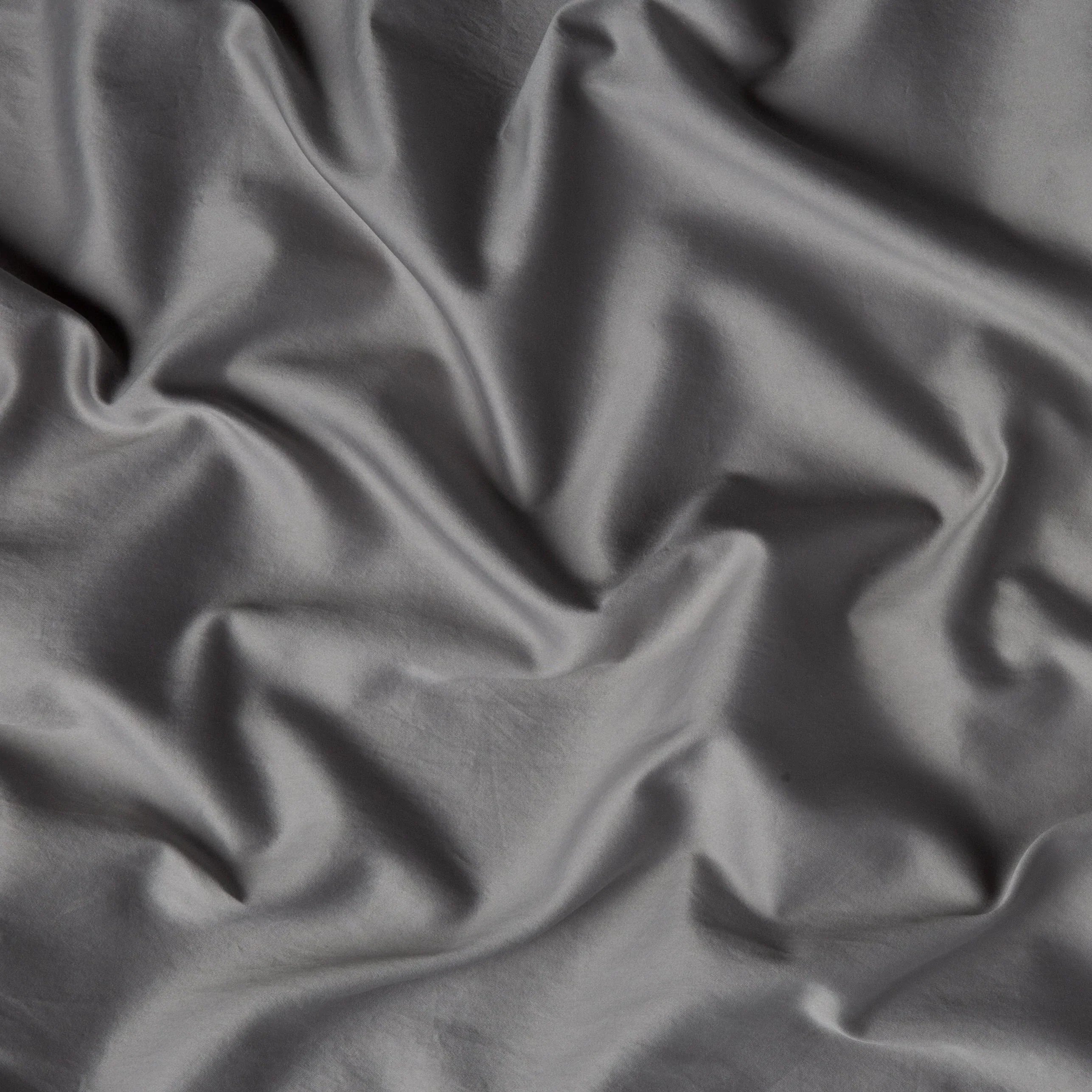 Moonlight: A close up of cotton sateen fabric in moonlight, a saturated, cool, mid-dark grey tone.