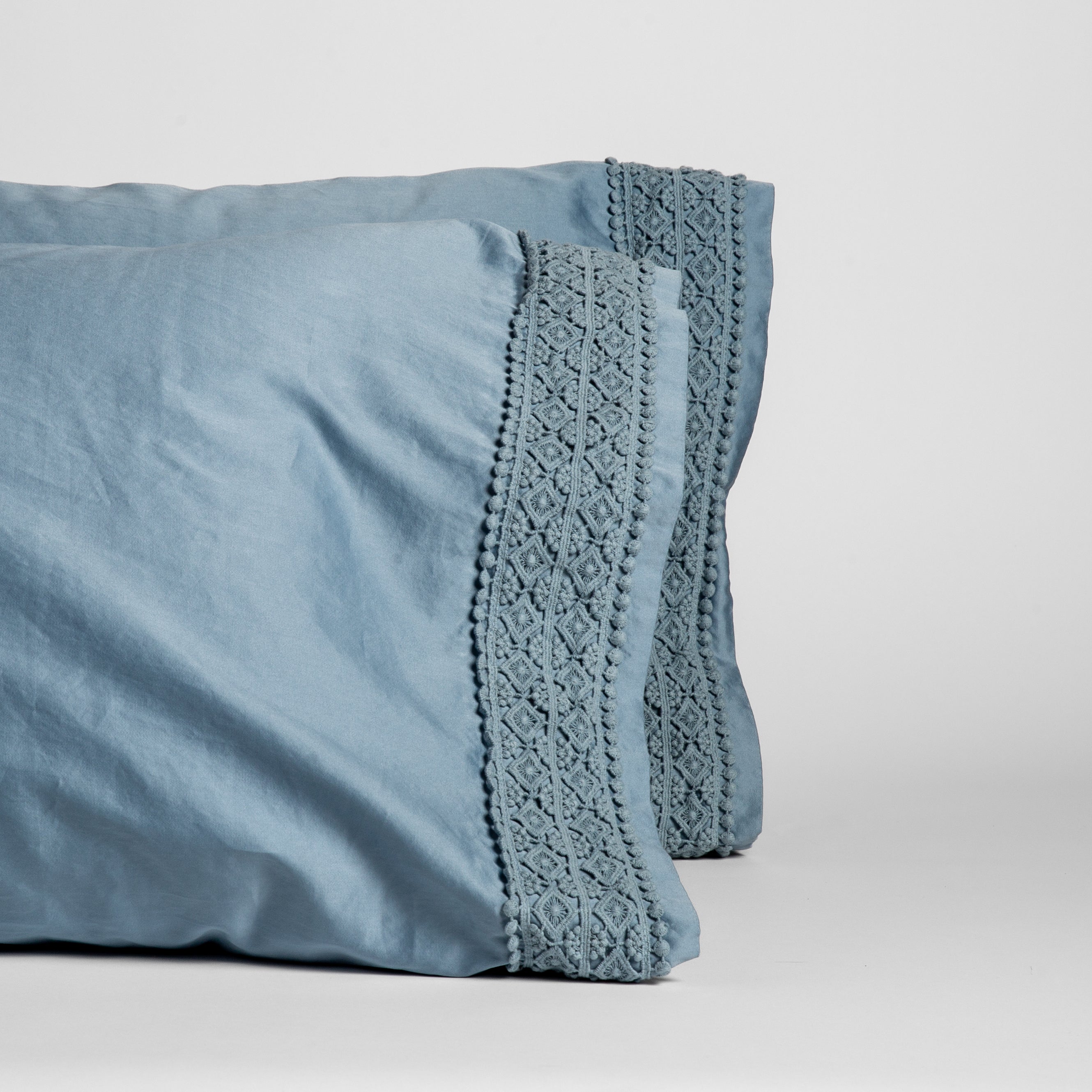 Tahoe Blue: cotton sateen pillowcases with cotton lace on the cuff on a white background