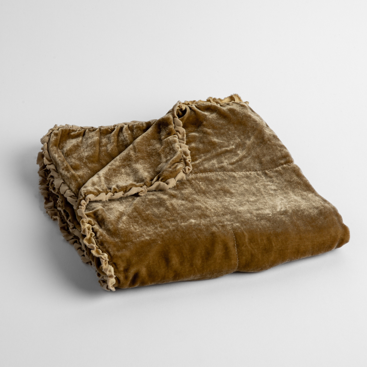 Honeycomb: silk velvet baby blanket with charmeuse trim shown slightly overhead with a corner folded back to show trim detail against a white background.