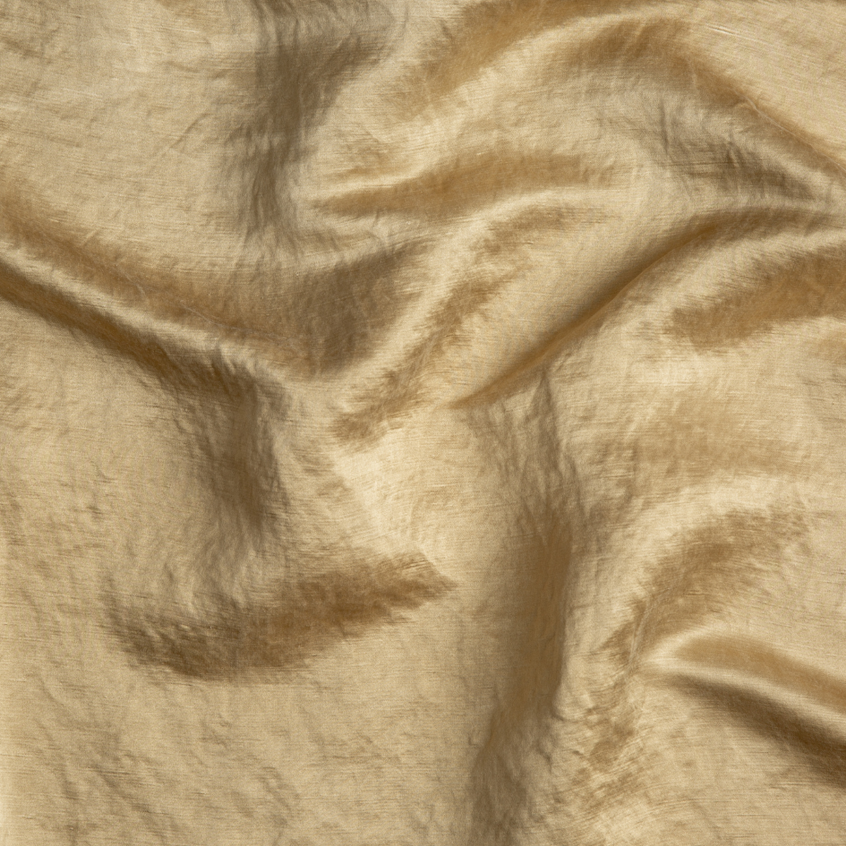 Honeycomb: A close up of charmeuse fabric in honeycomb, a warm golden tone.