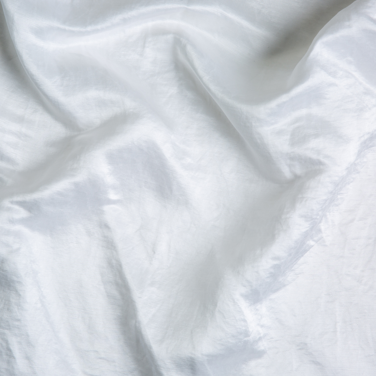 White: A close up of charmeuse fabric in classic white.