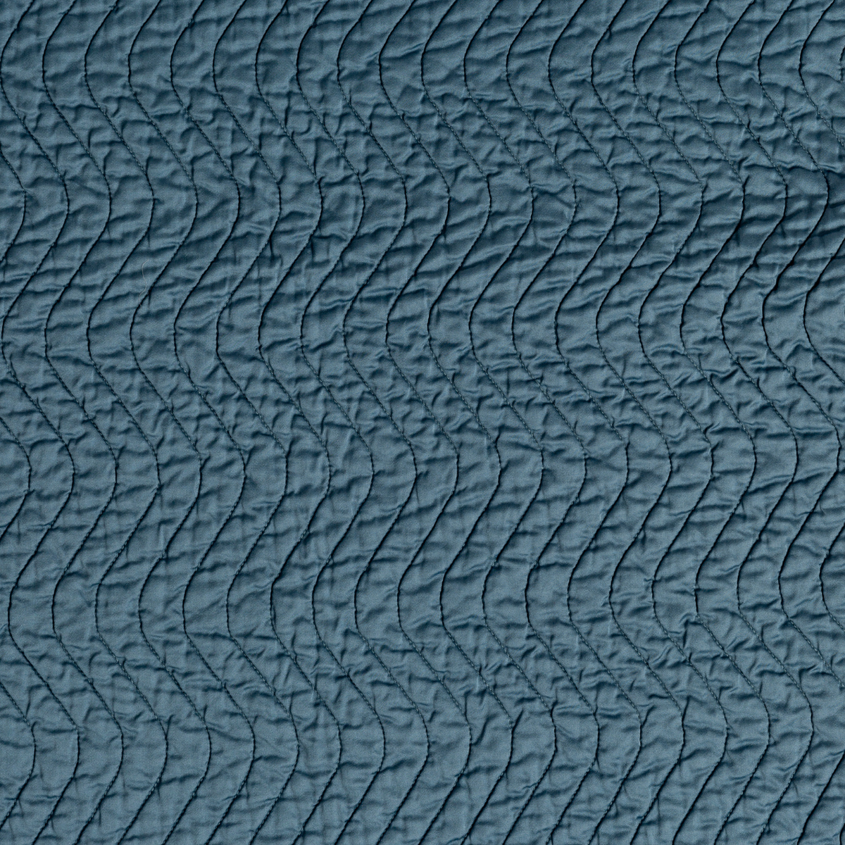 Cenote: A close up of quilted cotton sateen fabric in cenote, a vibrant, ocean-inspired blue-green.