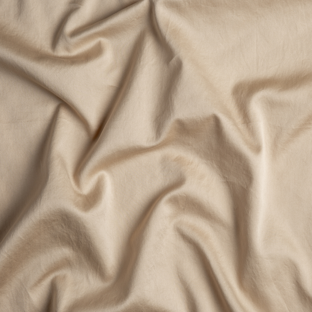 Honeycomb: A close up of cotton sateen fabric in honeycomb, a warm golden tone.