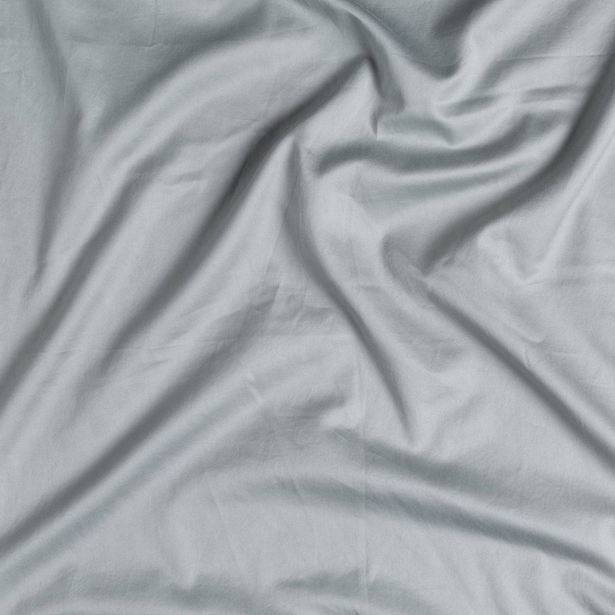 Mineral: A close up of cotton sateen fabric in mineral, a soothing seafoam blue with subtle grey-green undertones.