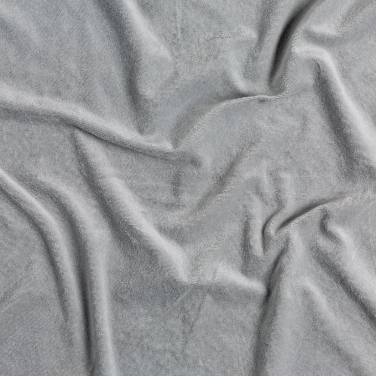 Mineral: A close up of cotton velvet fabric in mineral, a soothing seafoam blue with subtle grey-green undertones.