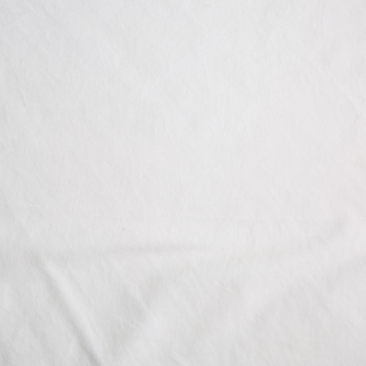 White: A close up of cotton velvet fabric in classic white.