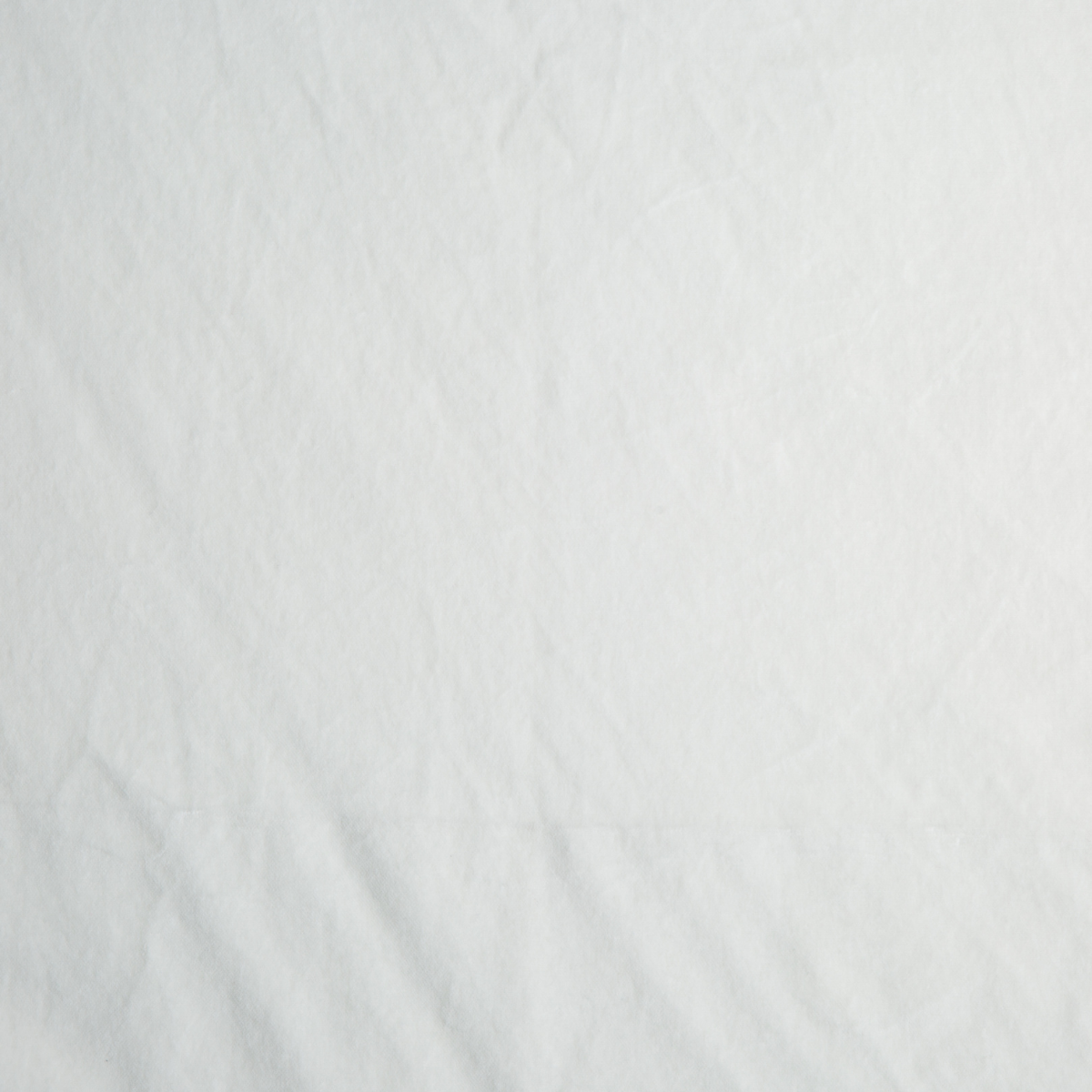 Winter White: A close up of cotton velvet fabric in winter white, softer and warmer in tone than classic white.