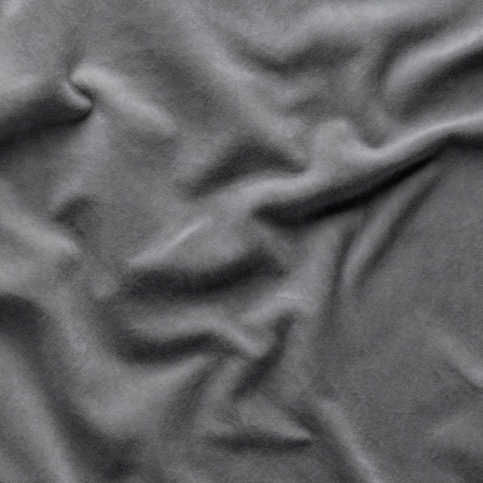 Moonlight: A close up of cotton velvet in moonlight, a saturated, cool, mid-dark grey tone.