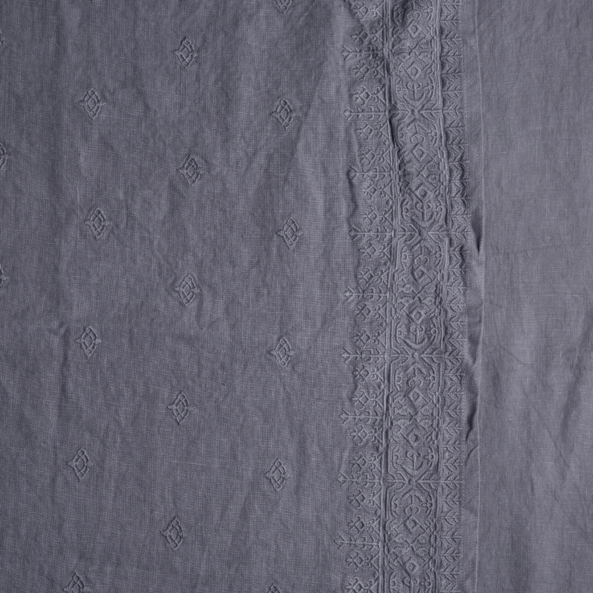 French Lavender: a close up of embroidered midweight linen fabric in french lavender, a neutral violet tone.