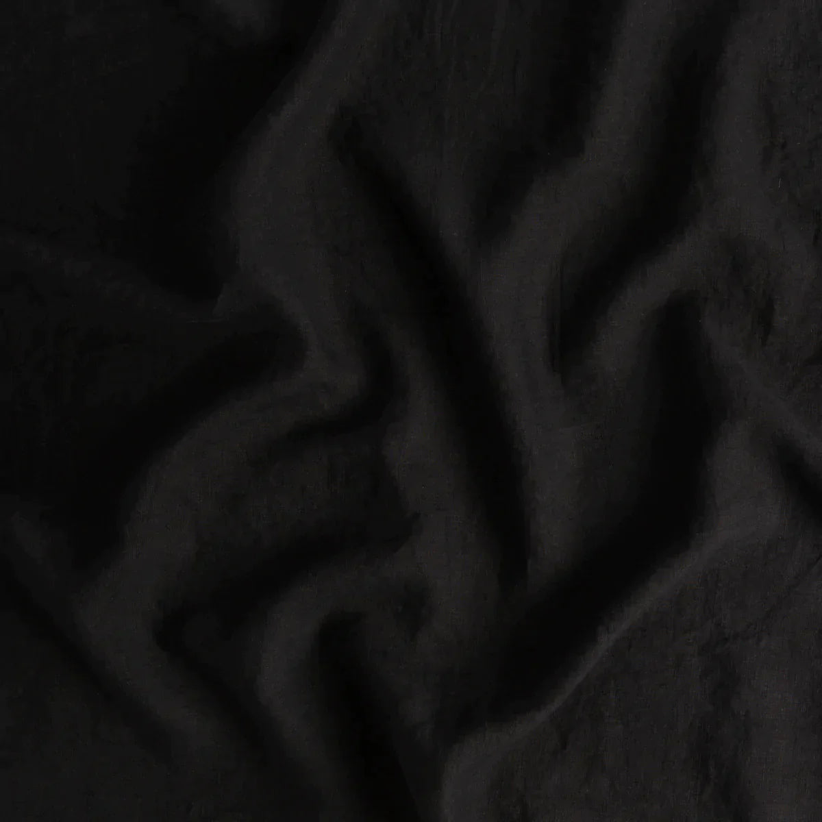 Corvino: A close up of linen fabric in Corvino, a black tone