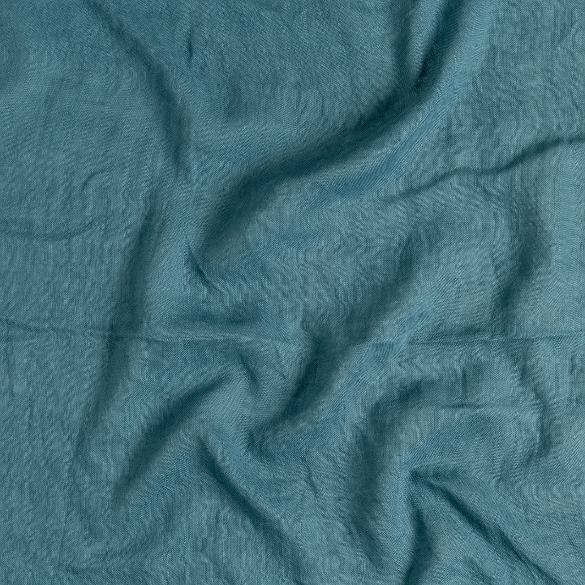 Cenote: A close up of linen whisper fabric in cenote, a vibrant, ocean-inspired blue-green.