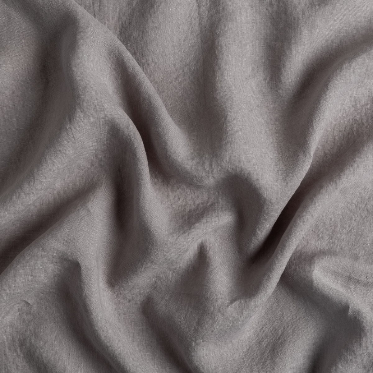 Moonlight: A close up of linen fabric in moonlight, a saturated, cool, mid-dark grey tone.