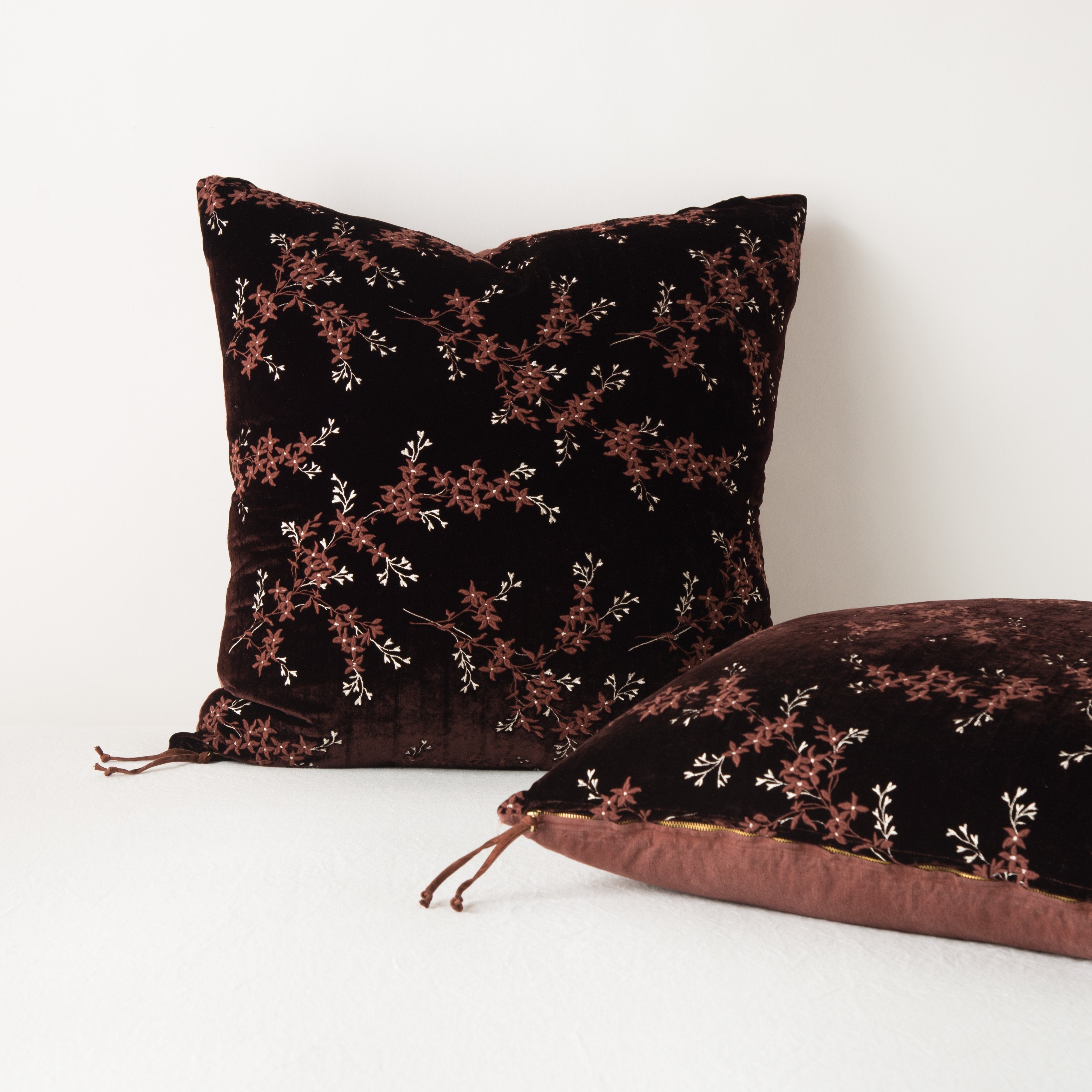 : Two Lynette shams against a light background: one upright and one laying flat, highlighting zipper detail and linen back.