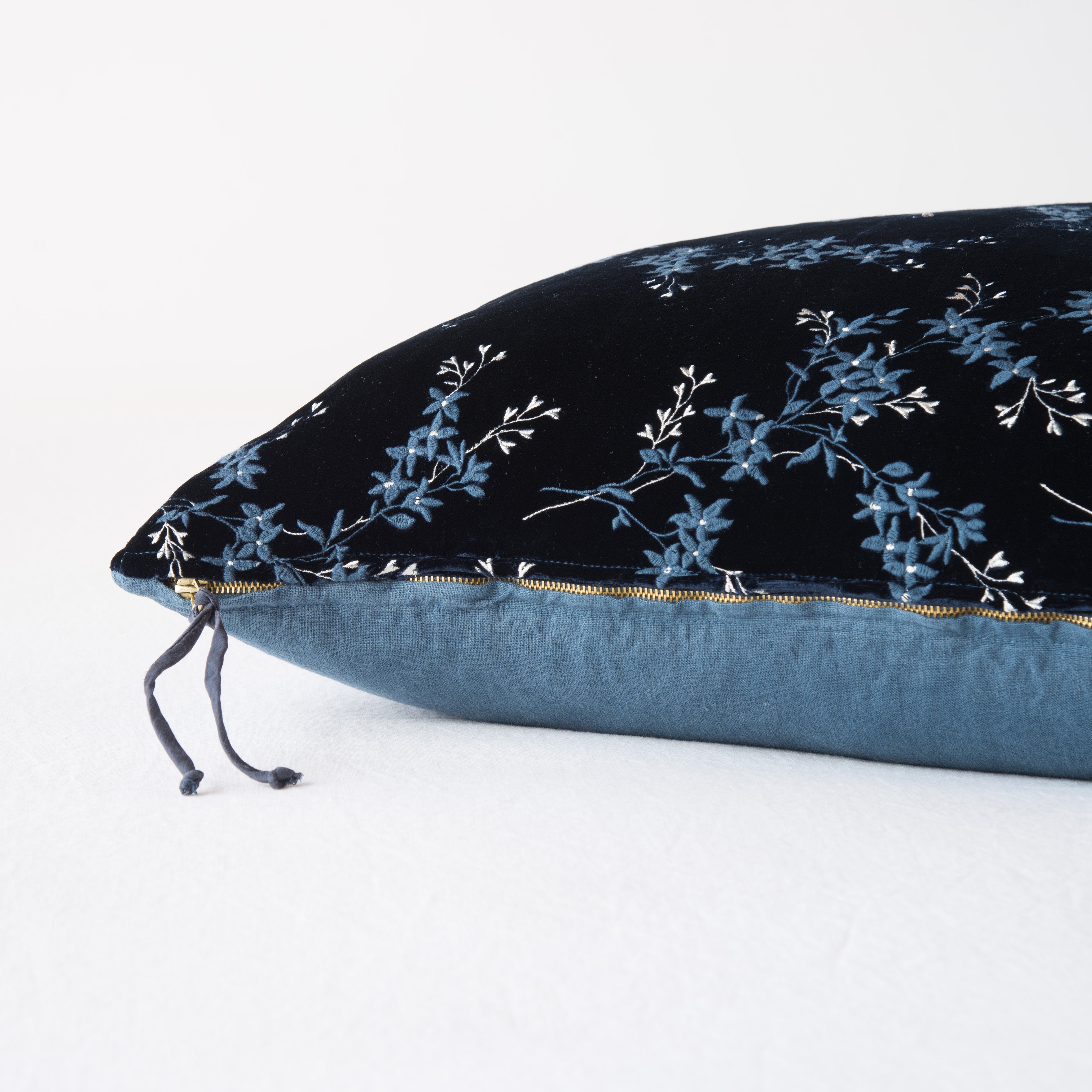 Midnight: Close-up side vew featuring brass zipper with charmeuse pull, and linen back.