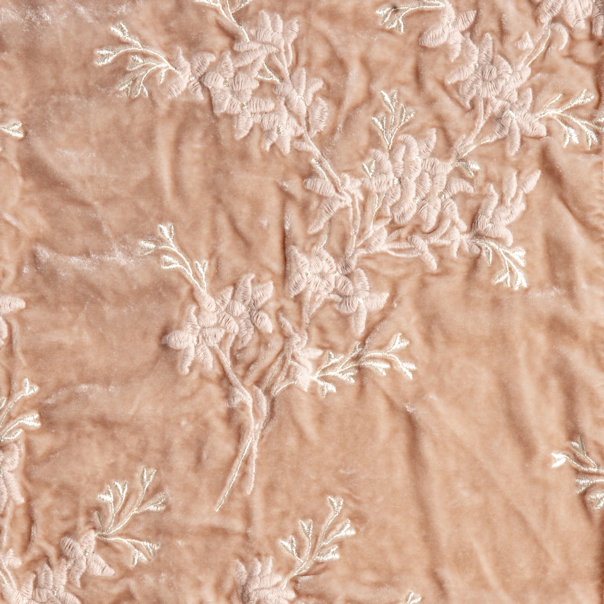 Pearl: A close up of embroidered silk velvet fabric in pearl, a nude-like, soft rose pink tone.