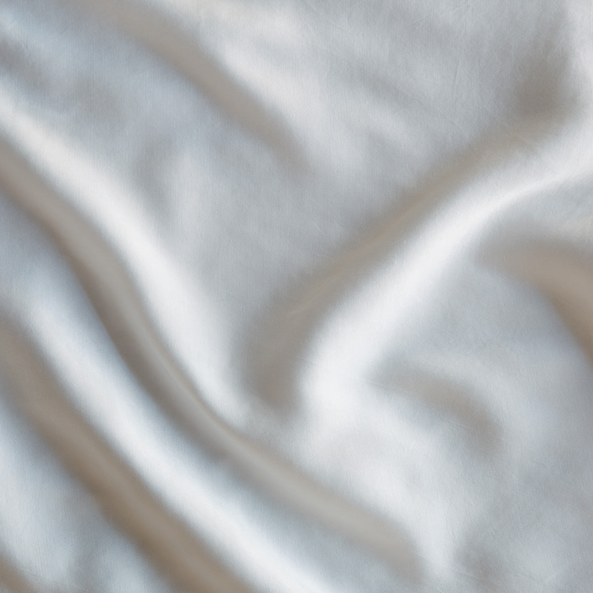 Winter White: A close up of Tencel™ fabric in winter white, softer and warmer in tone than classic white.