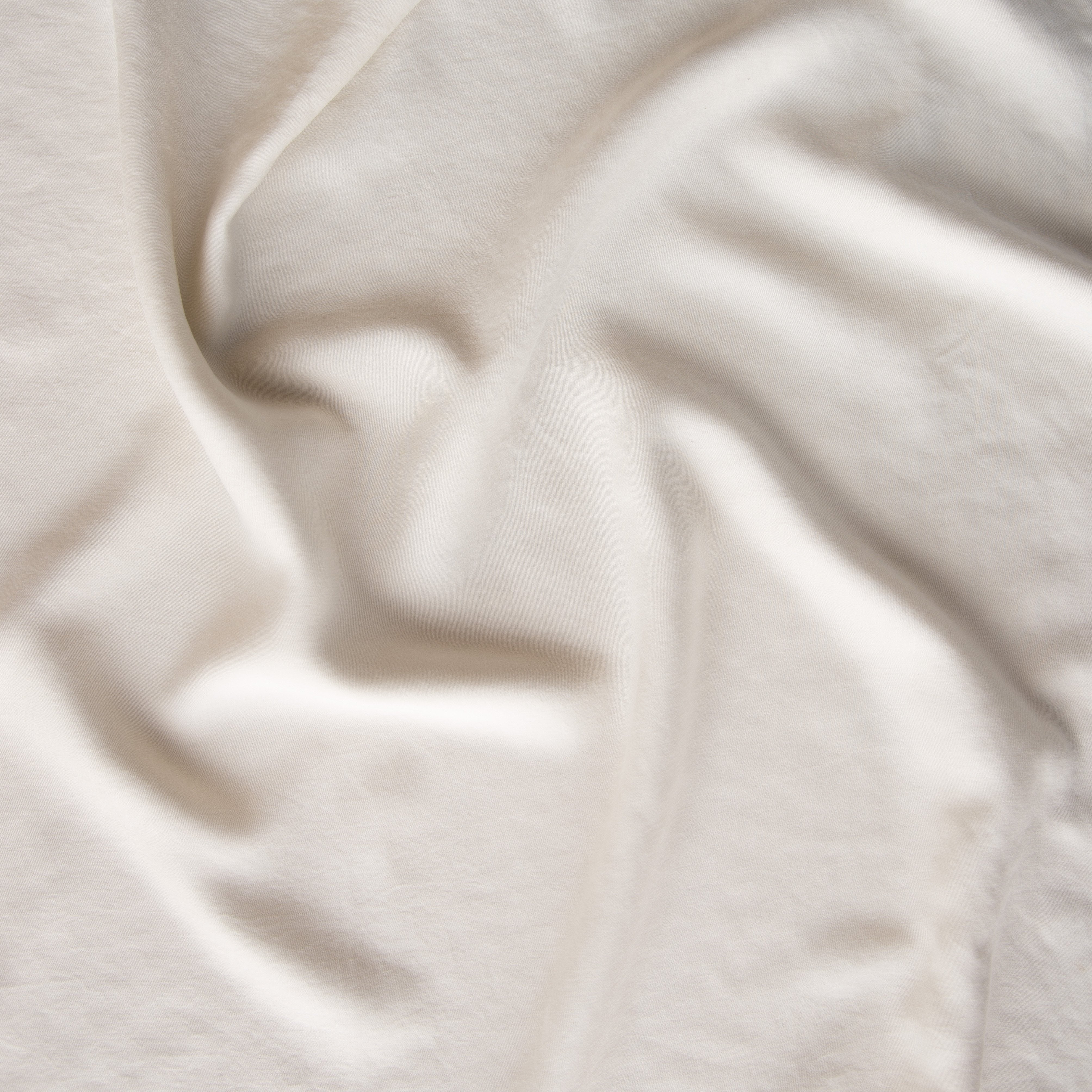Parchment: A close up of Tencel™ fabric in parchment, a warm, antiqued cream.