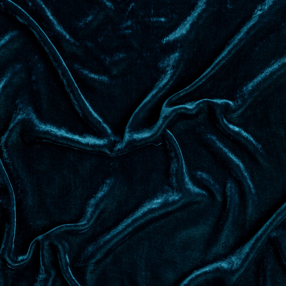 Cenote: A close up of silk velvet fabric in cenote, a vibrant, ocean-inspired blue-green.