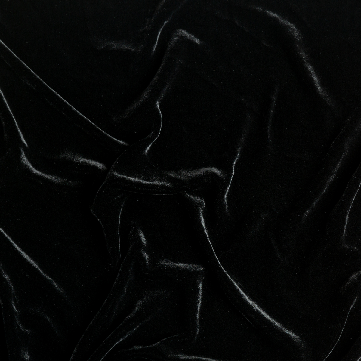 Corvino: A close up of silk velvet fabric in Corvino, a black tone.