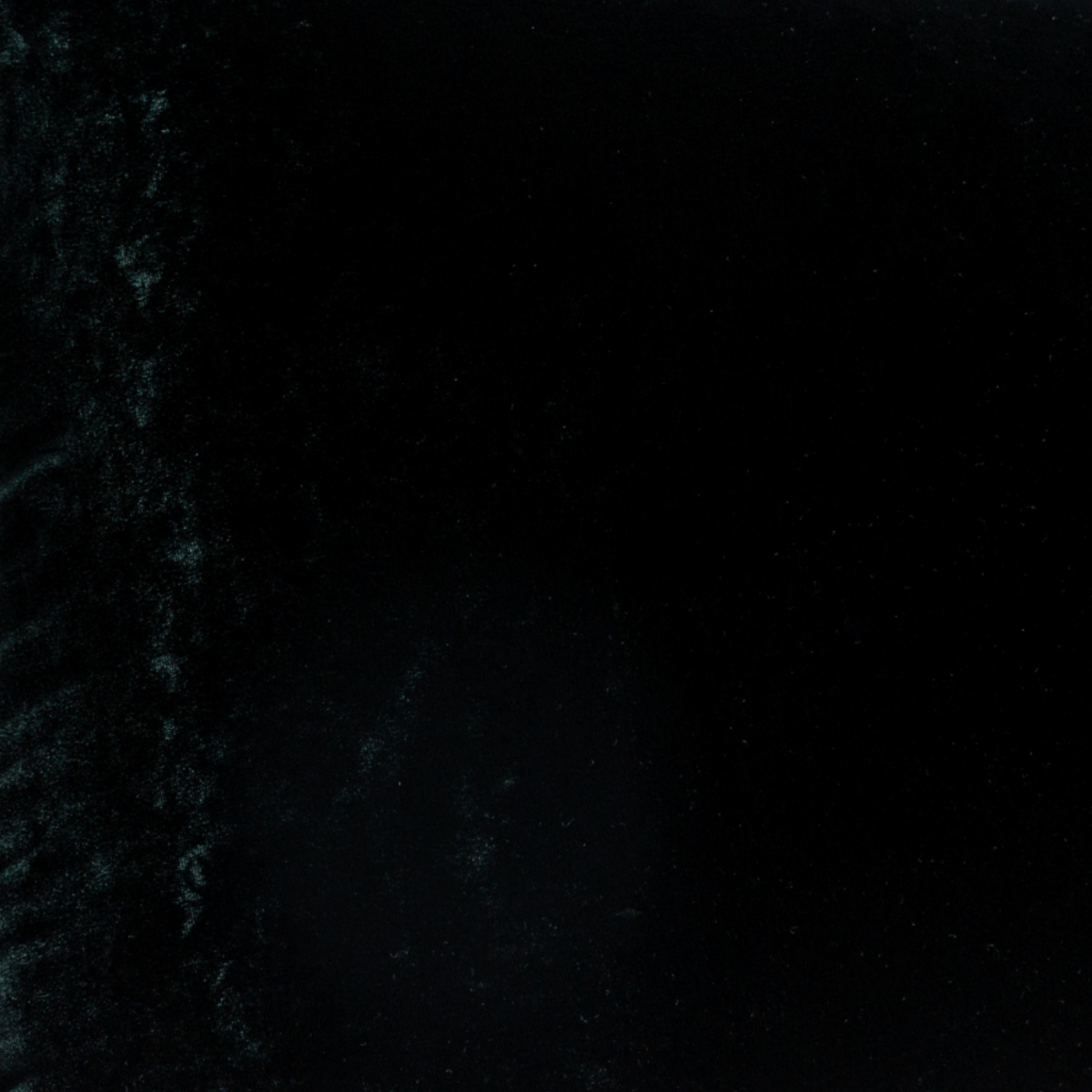 Juniper: A close up of silk velvet fabric in Juniper, a deep green tone.