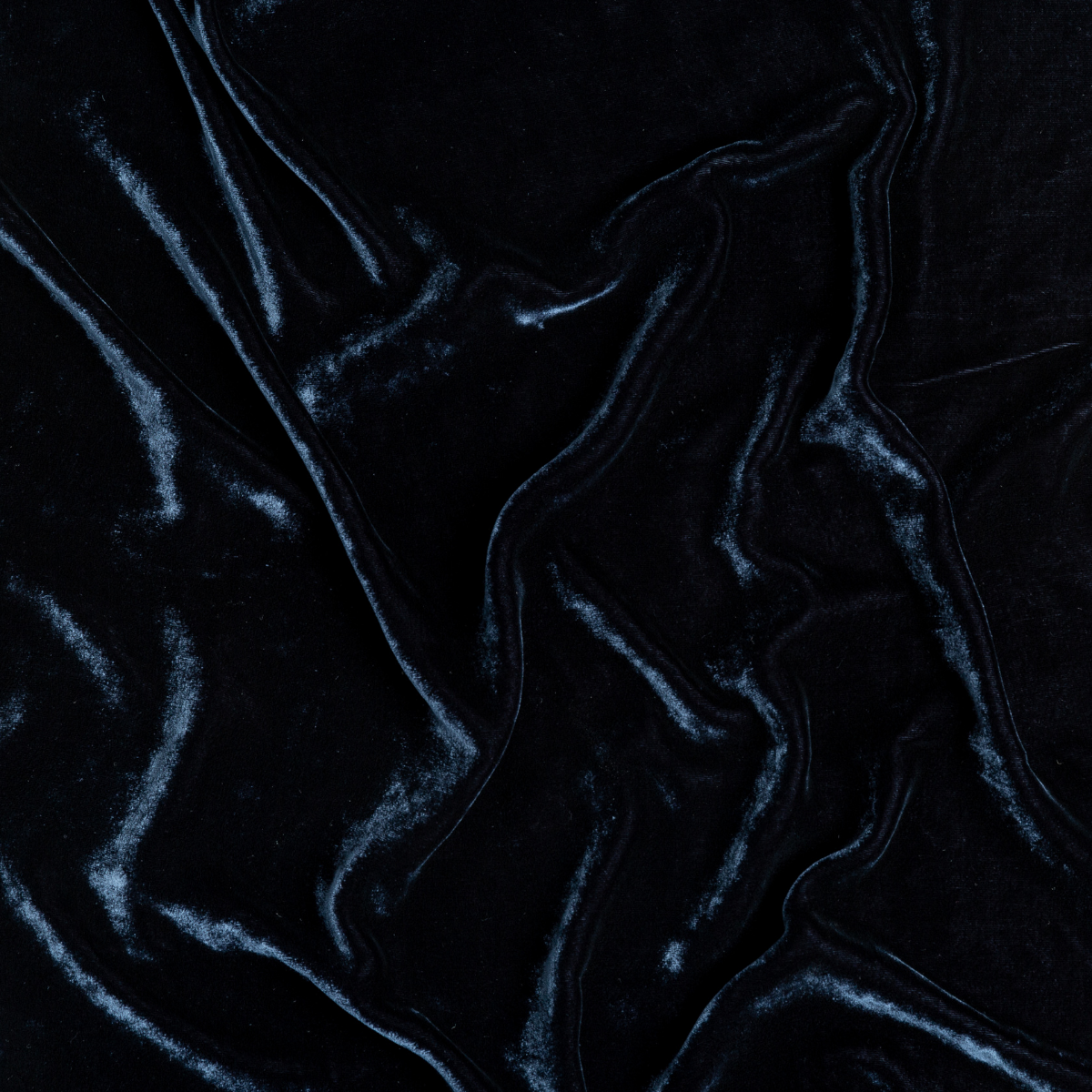 Midnight: A close up of silk velvet fabric in midnight, a rich indigo tone.