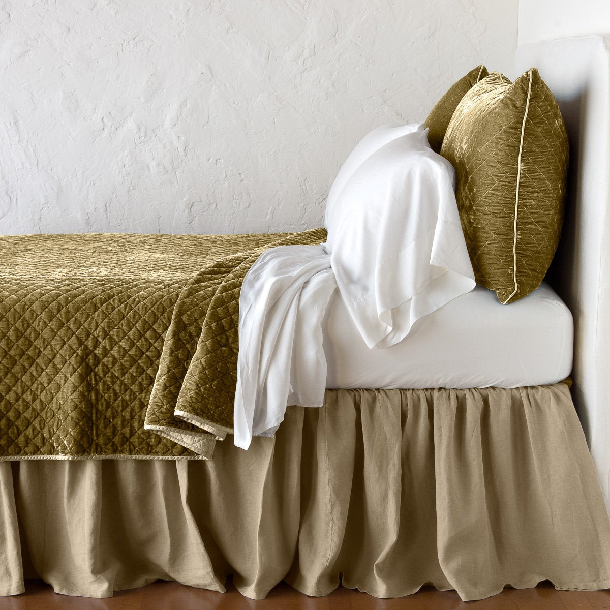 Honeycomb: coverlet with matching shams and white sheeting - side view.