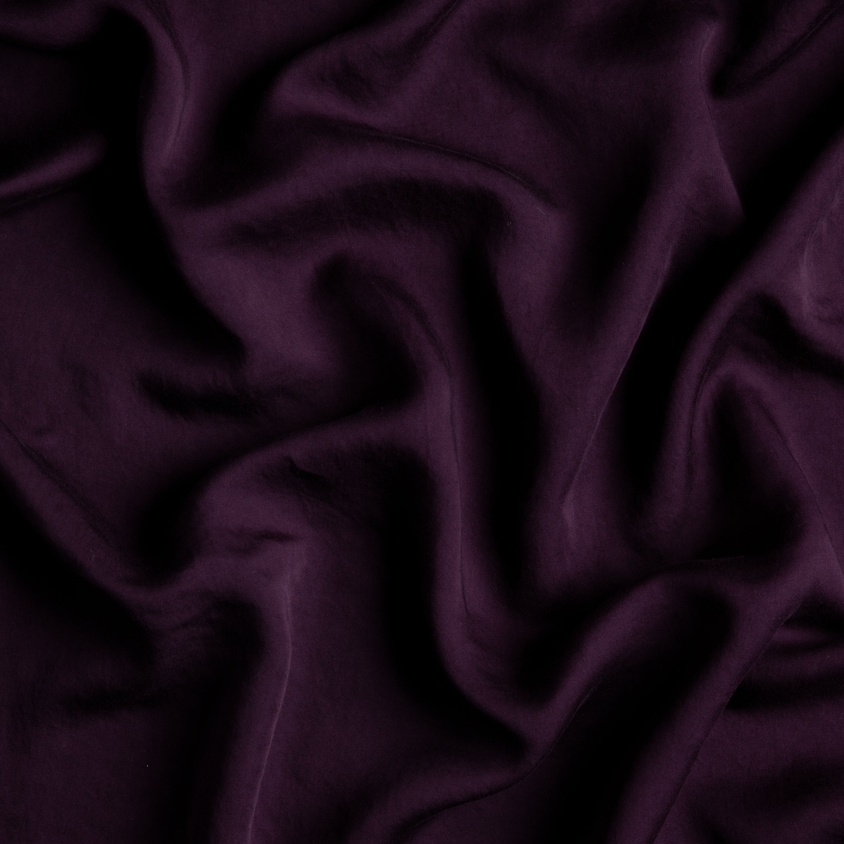Fig: A close up of Tencel™ fabric in fig, a richly saturated purple-garnet.