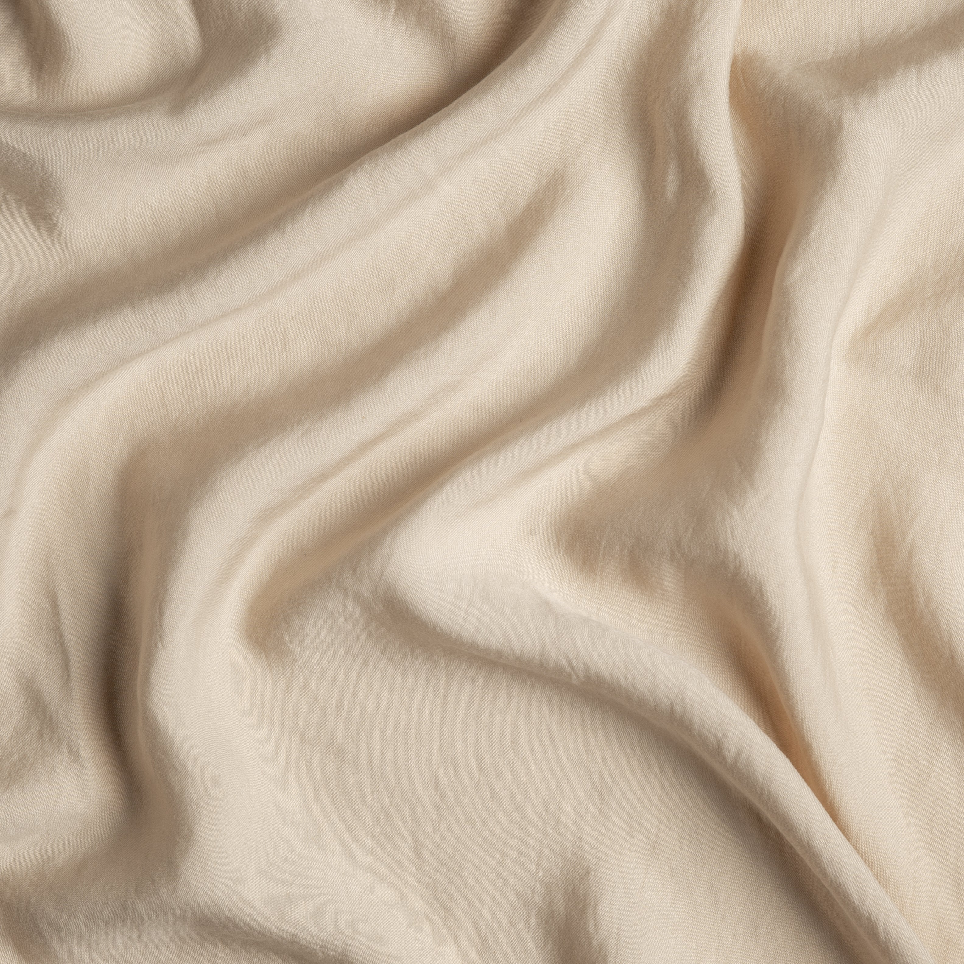 Honeycomb: A close up of Tencel™ fabric in honeycomb, a warm golden tone.