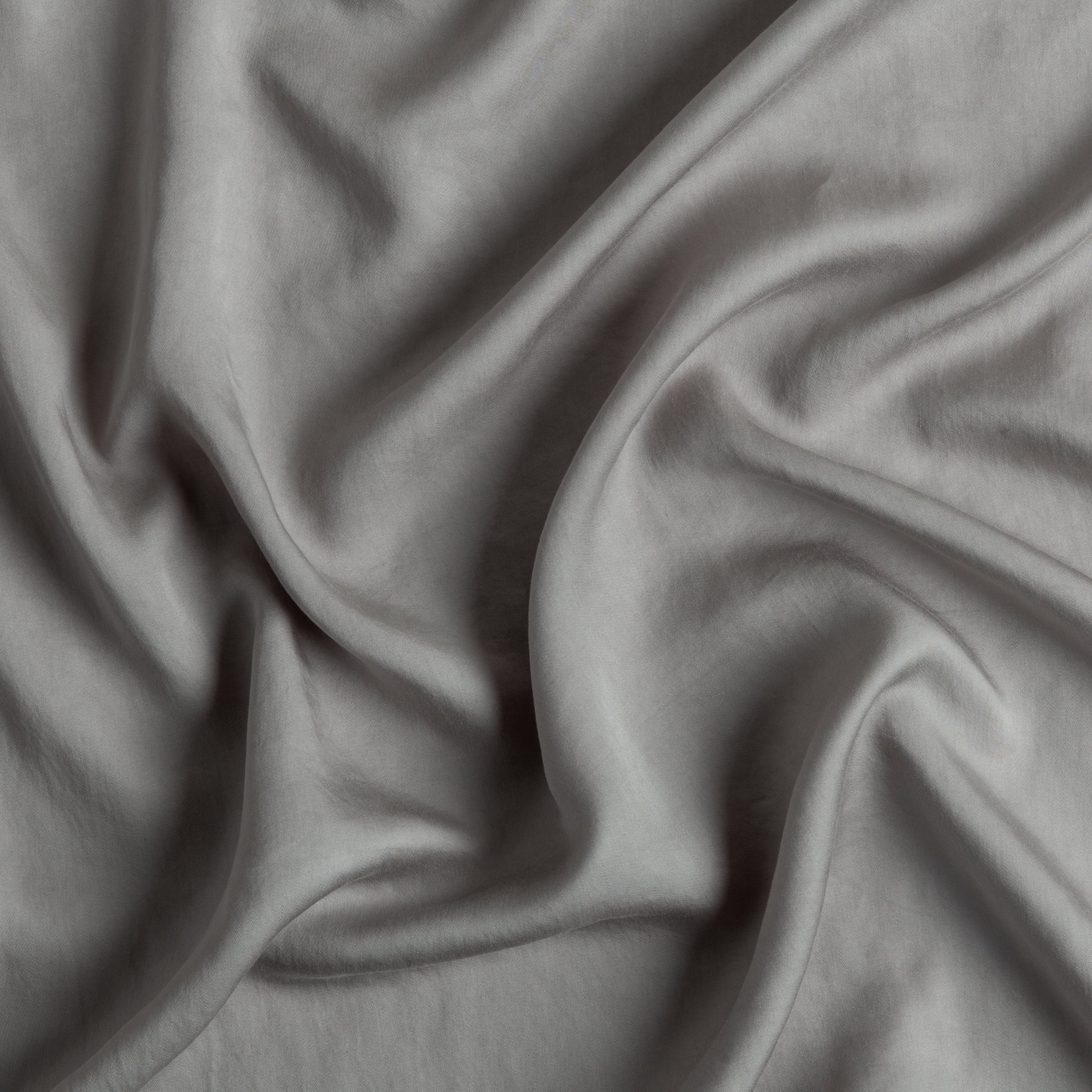 Moonlight: A close up of Tencel™ fabric in moonlight, a saturated, cool, mid-dark grey tone.