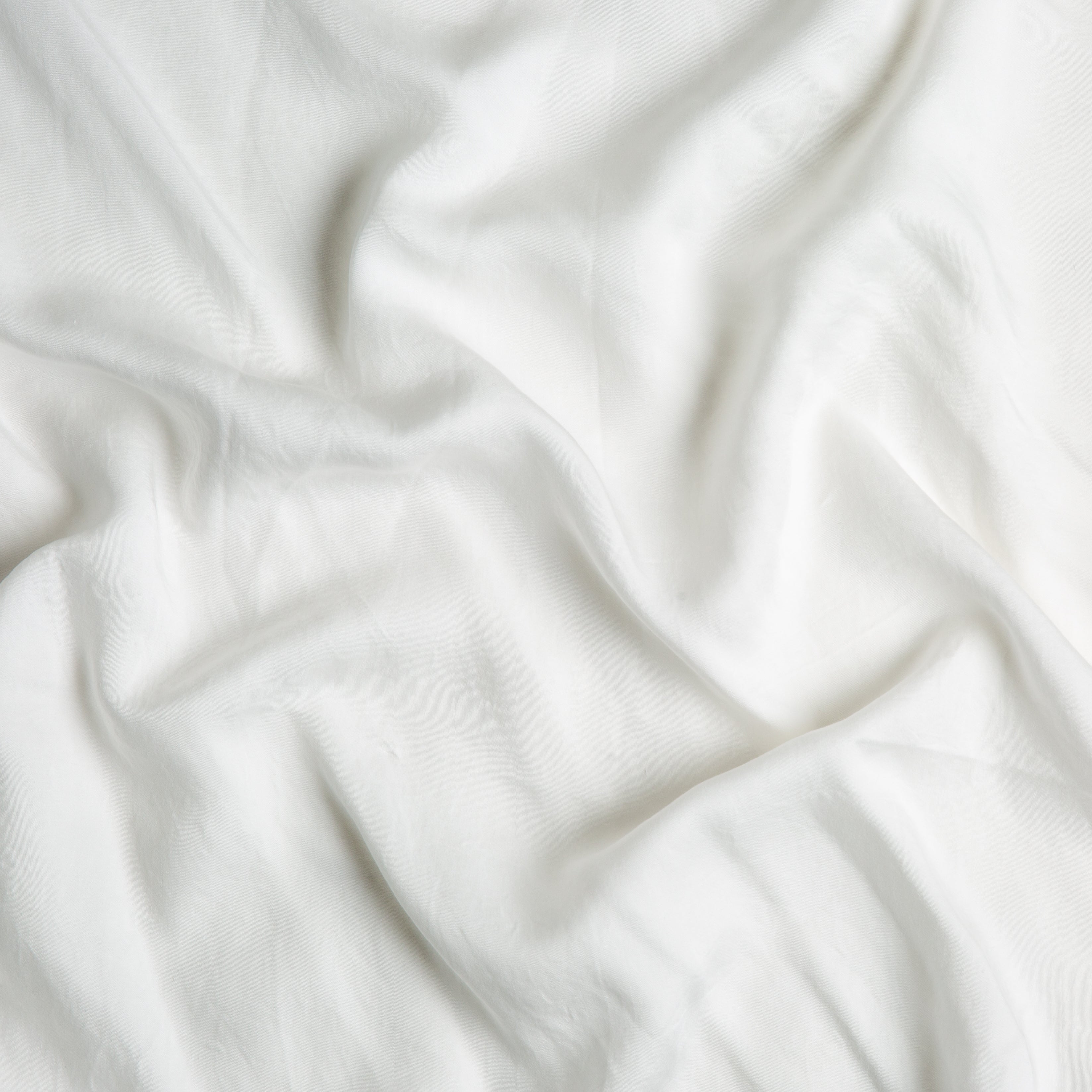 Winter White: A close up of Tencel™ fabric in winter white, softer and warmer in tone than classic white.