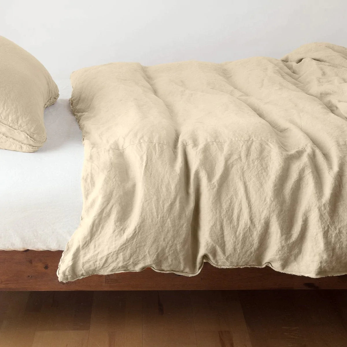 Honeycomb: Midweight linen duvet cover in honeycomb on a bed, side view.