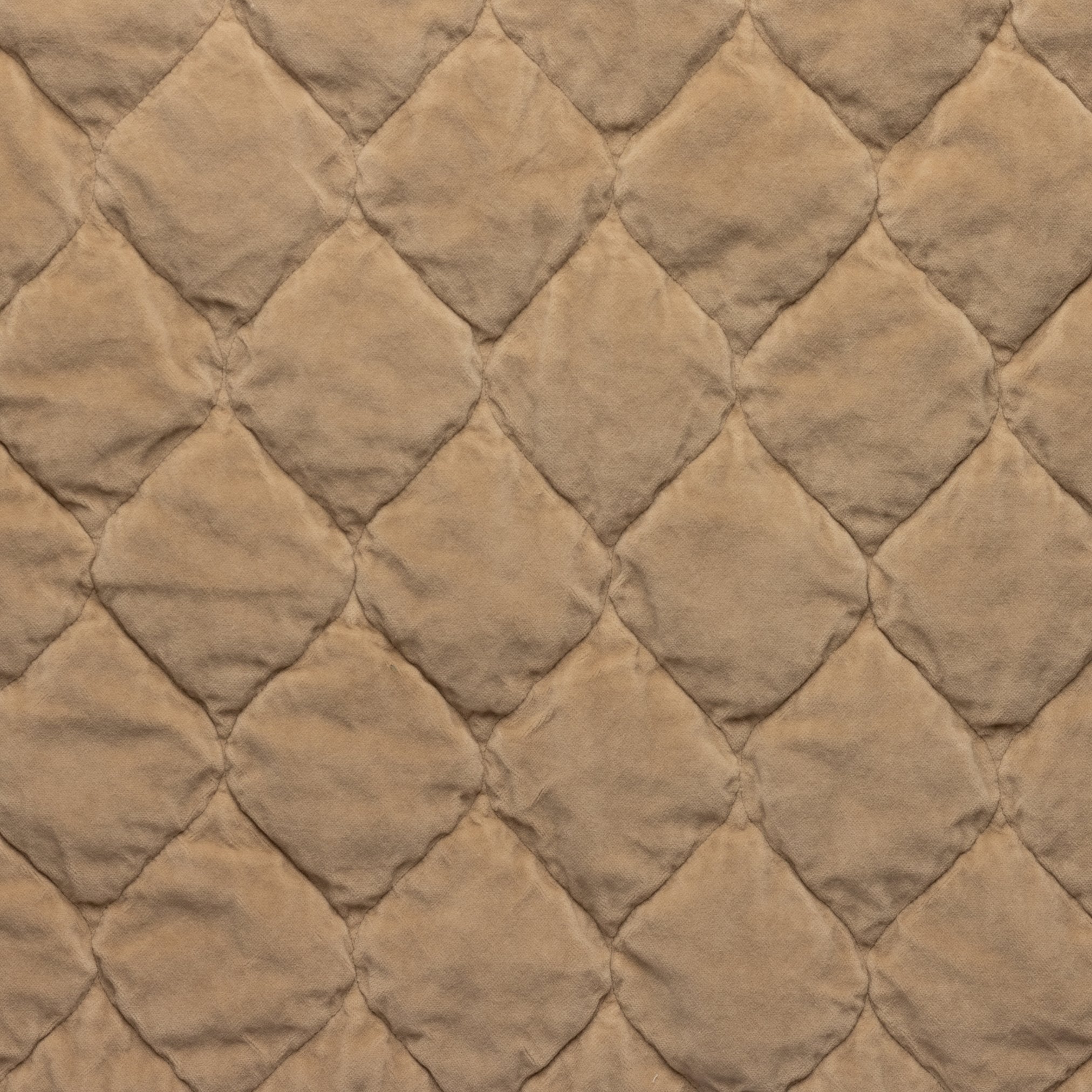 Honeycomb: Close-up of Harlow cotton velvet quilting in honeycomb, a warm golden tone.