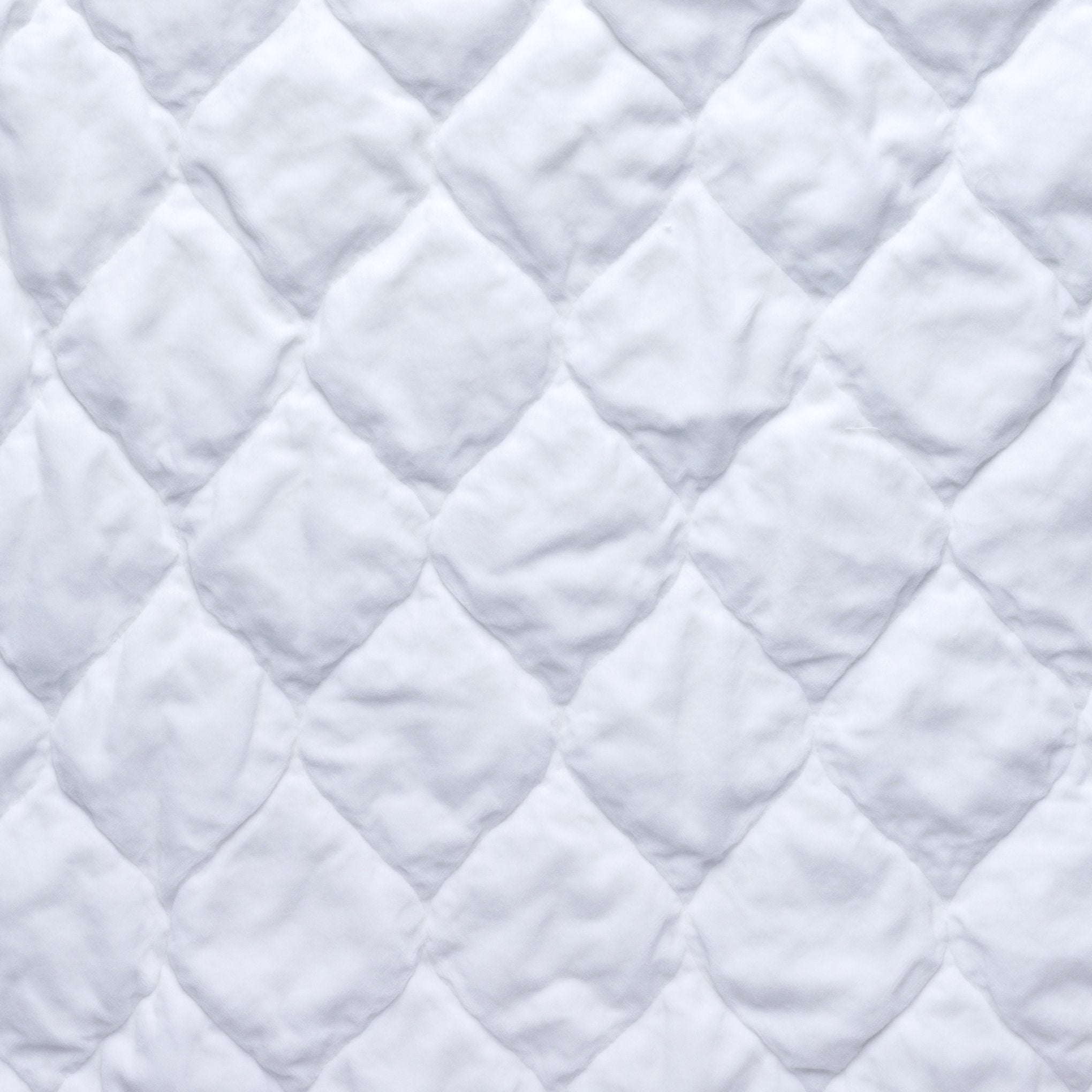 White: Close-up of Harlow cotton velvet quilting in white.