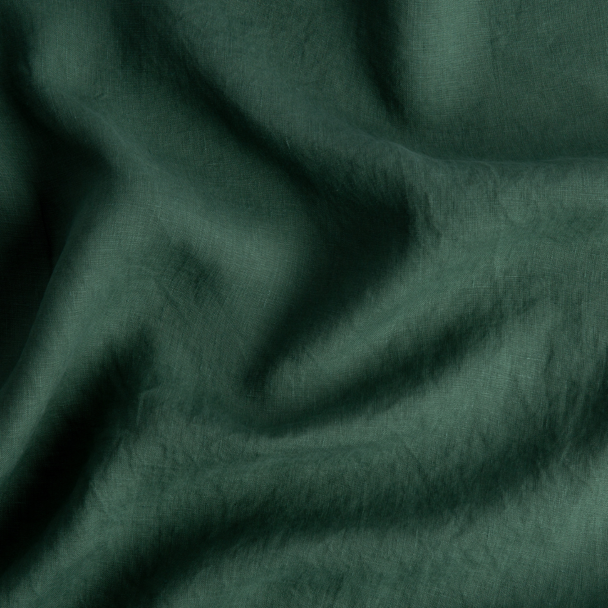 Jade: A close up of linen in jade, a rich, verdant green with subtle blue undertones.