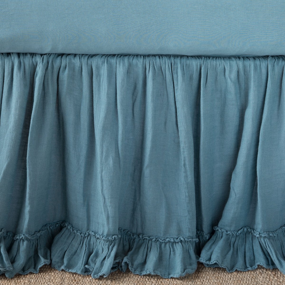 Cenote: Close up of bed skirt, showcasing ruffle detail - side view.