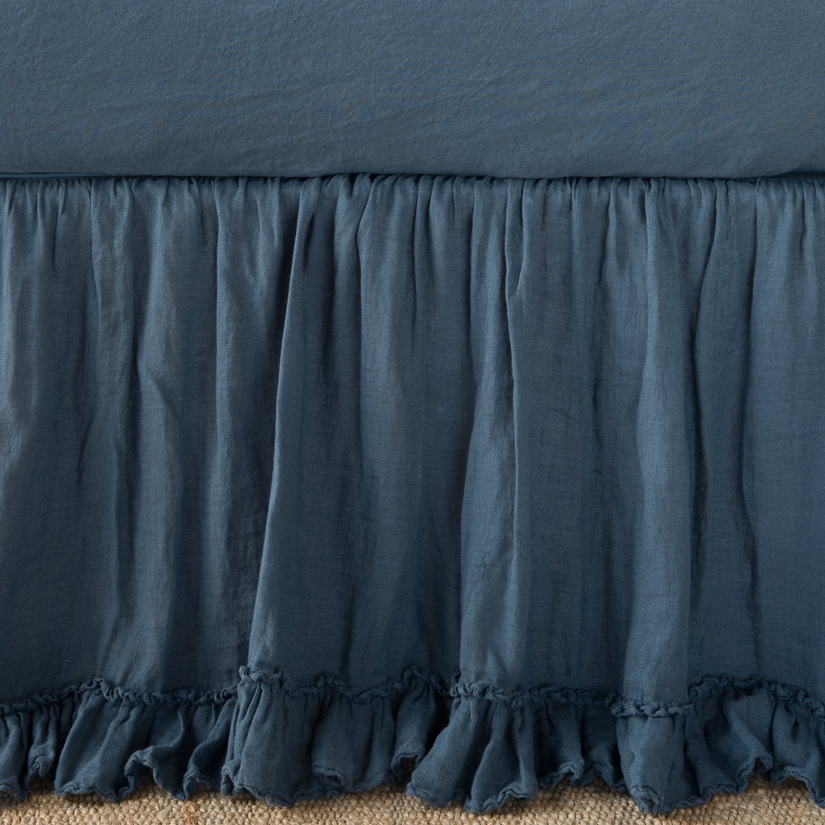 Midnight: Close up of bed skirt, showcasing ruffle detail - side view.