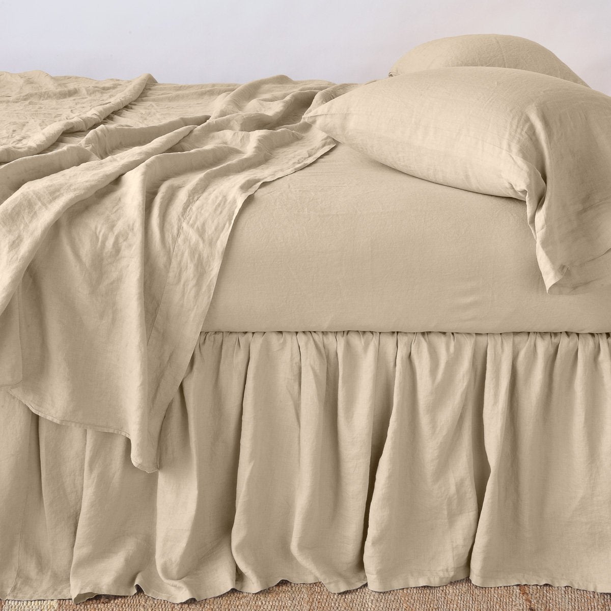 Honeycomb: bed skirt with matching rumpled sheets and sleeping pillows - side view.