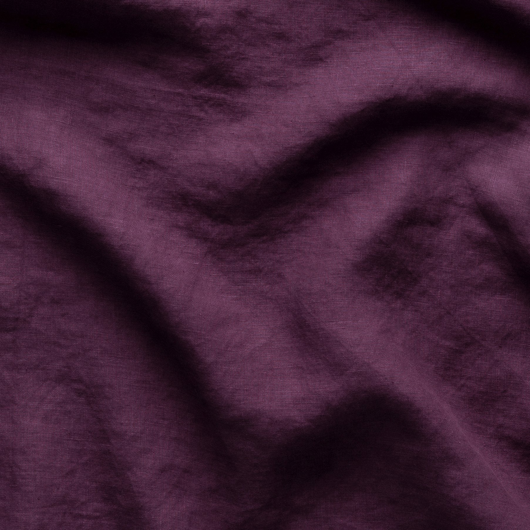 Fig: A close up of linen in fig, a richly saturated purple-garnet.
