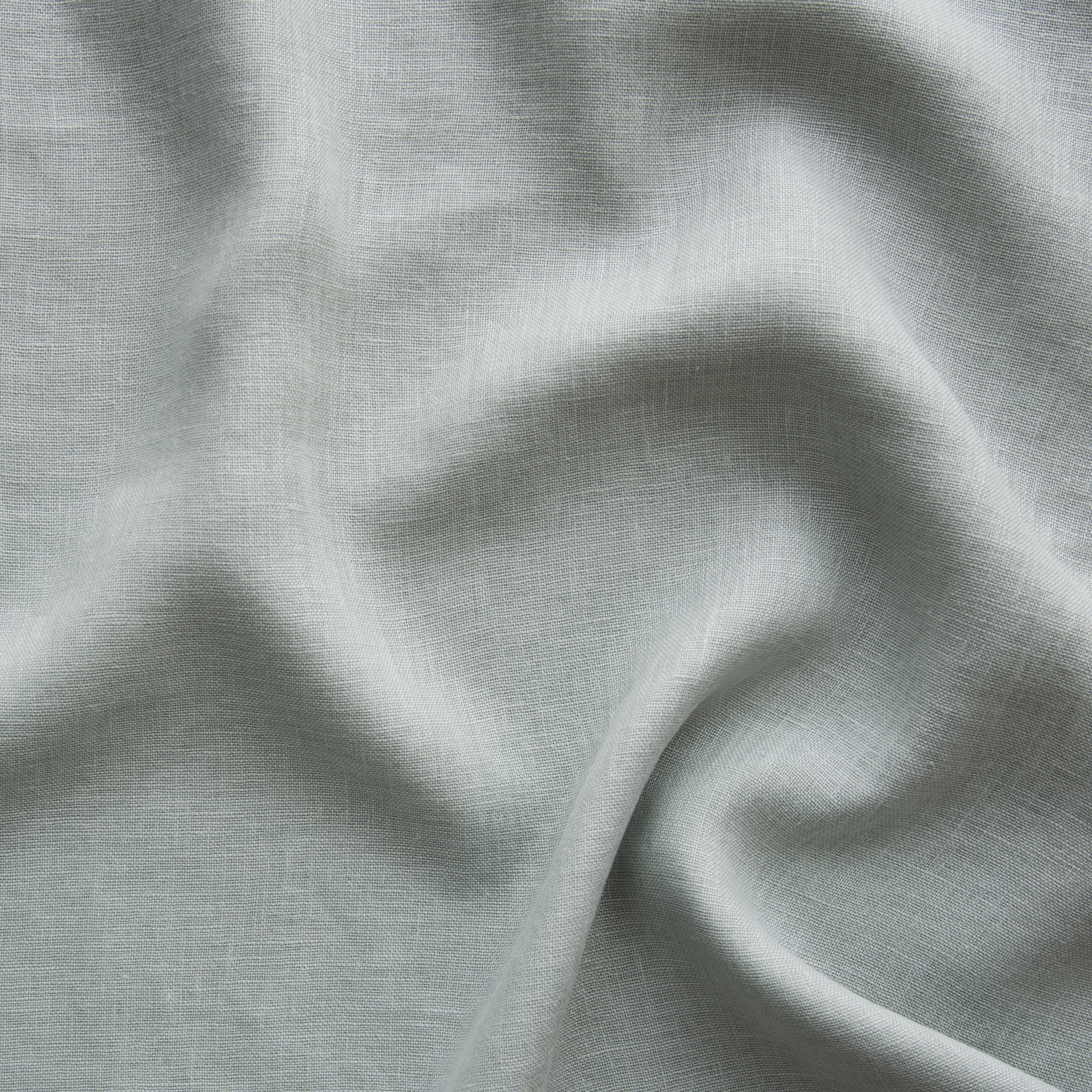 Eucalyptus: A close up of linen whisper, our lightweight linen gauze, in eucalyptus, a soft light green.