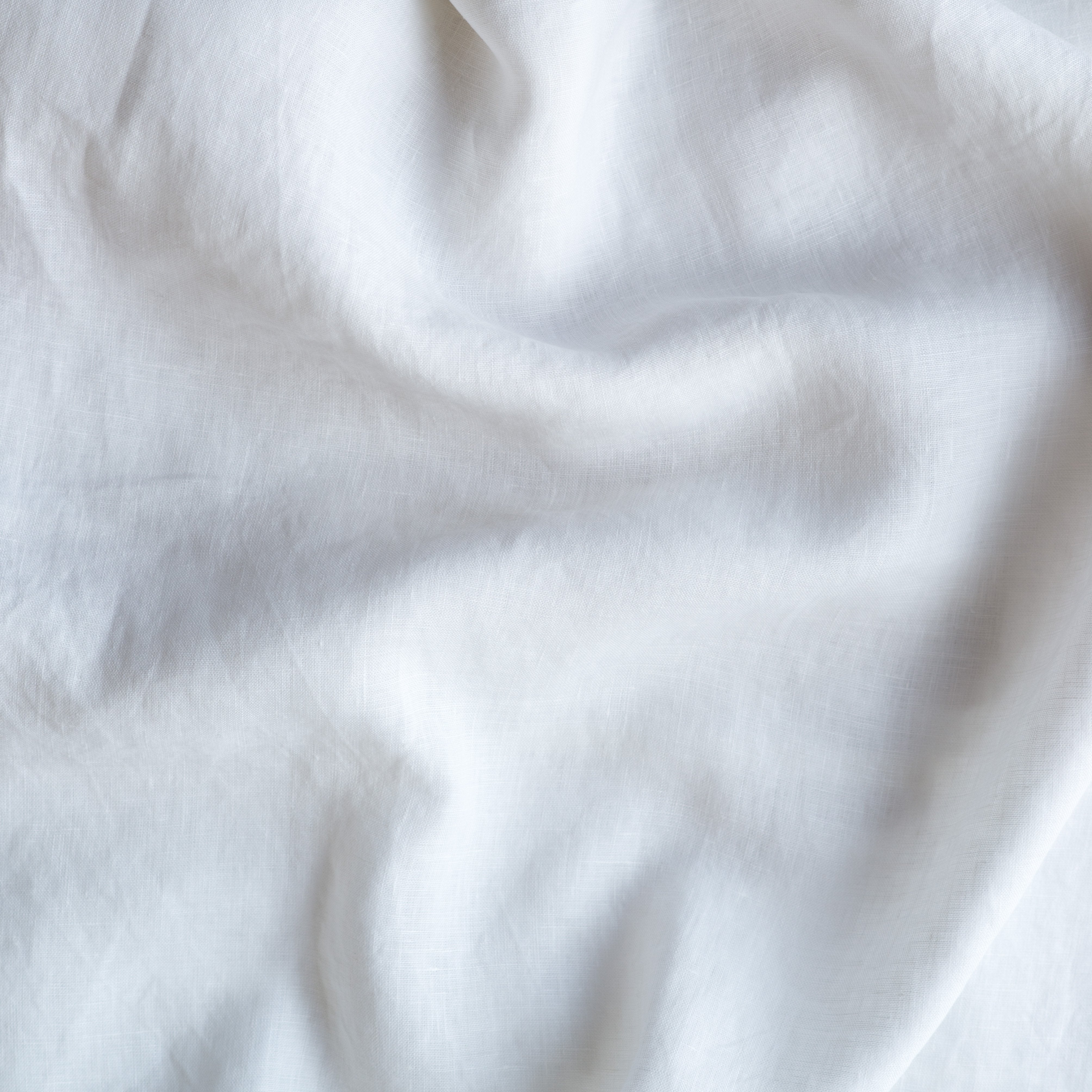 White: A close up of linen in white.