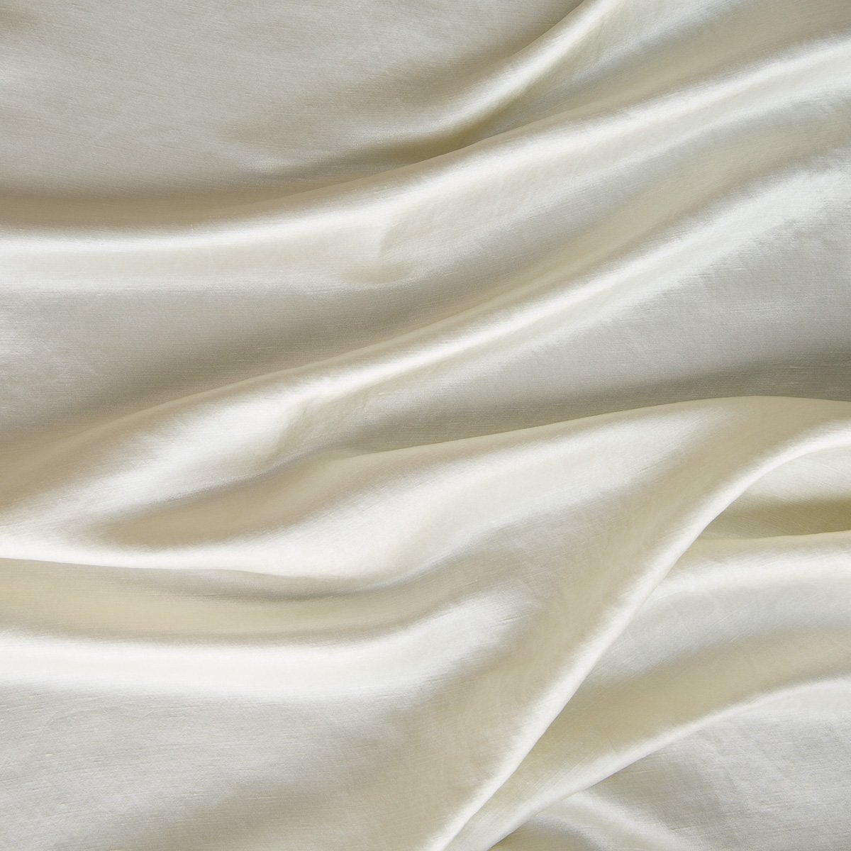 Parchment: Close-up of silk charmeuse in parchment, a warm, antiqued cream.