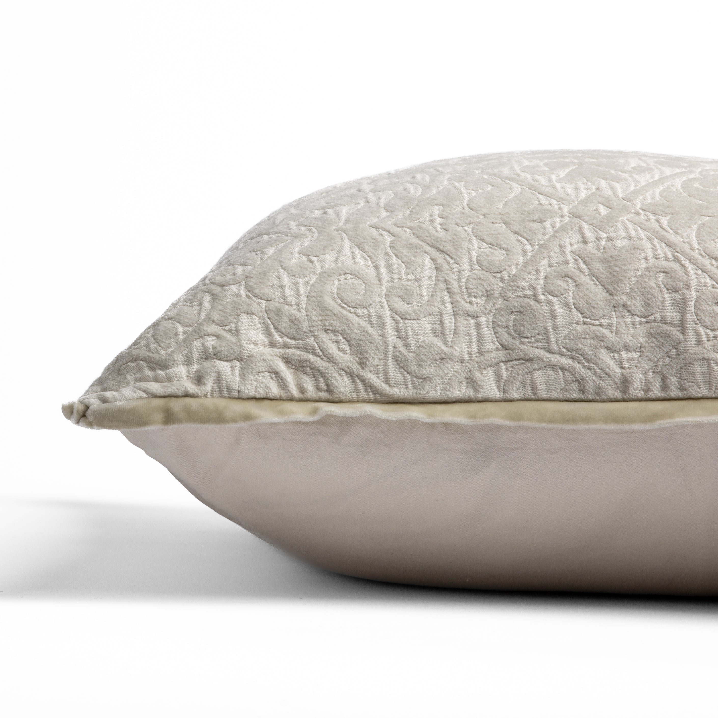 Parchment: side view of 18x18 pillow shows cotton sateen back and silk velvet trim detail — close up against a white background.